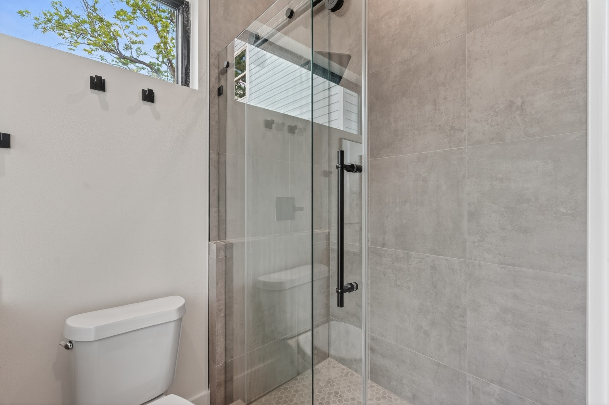 Well-appointed guest bathroom featuring modern finishes, a spacious vanity, and a clean, functional design.