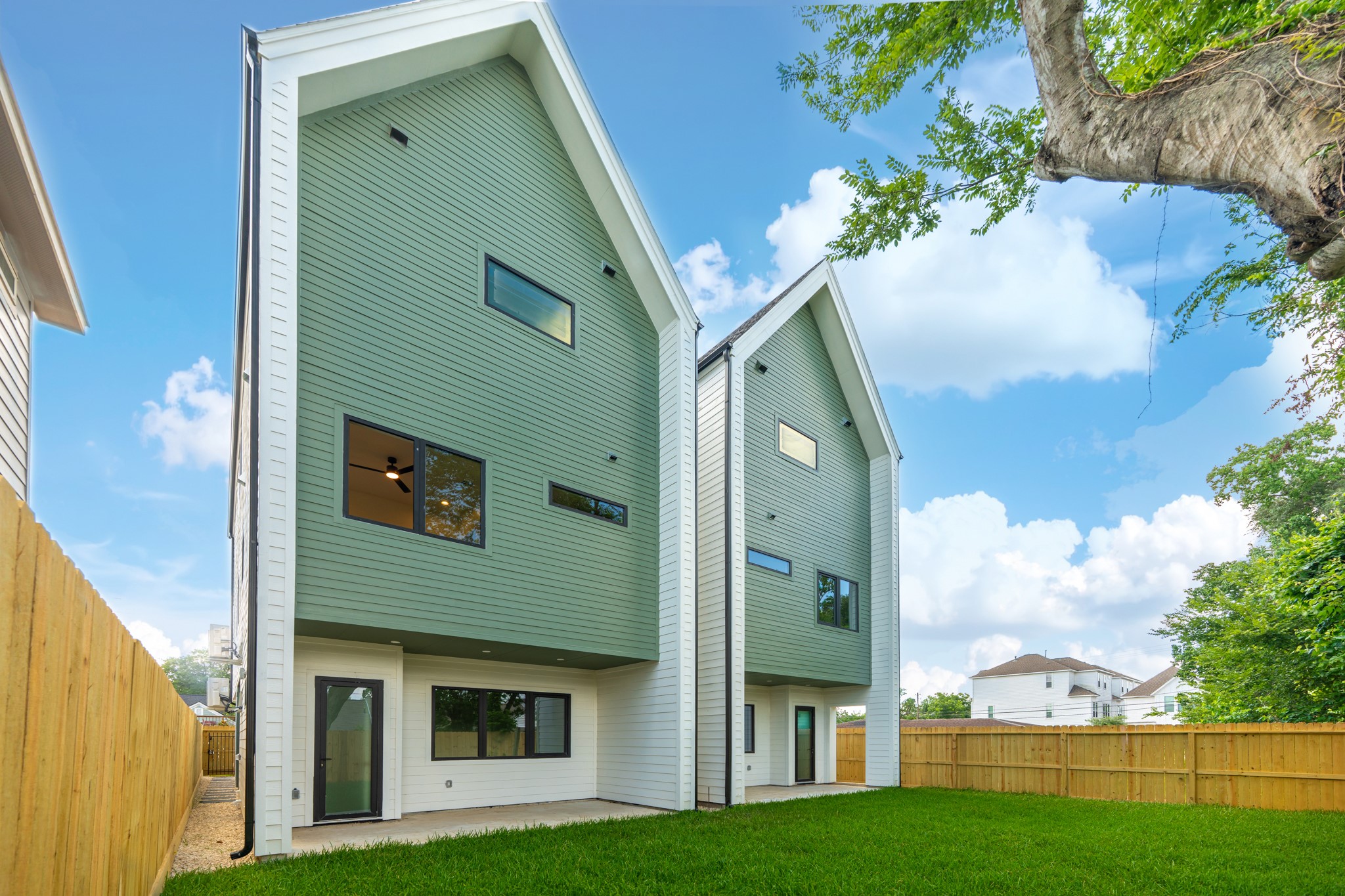 Large backyard with a covered patio offers ample space for outdoor living, entertaining, and enjoying everything Houston's weather has to offer.