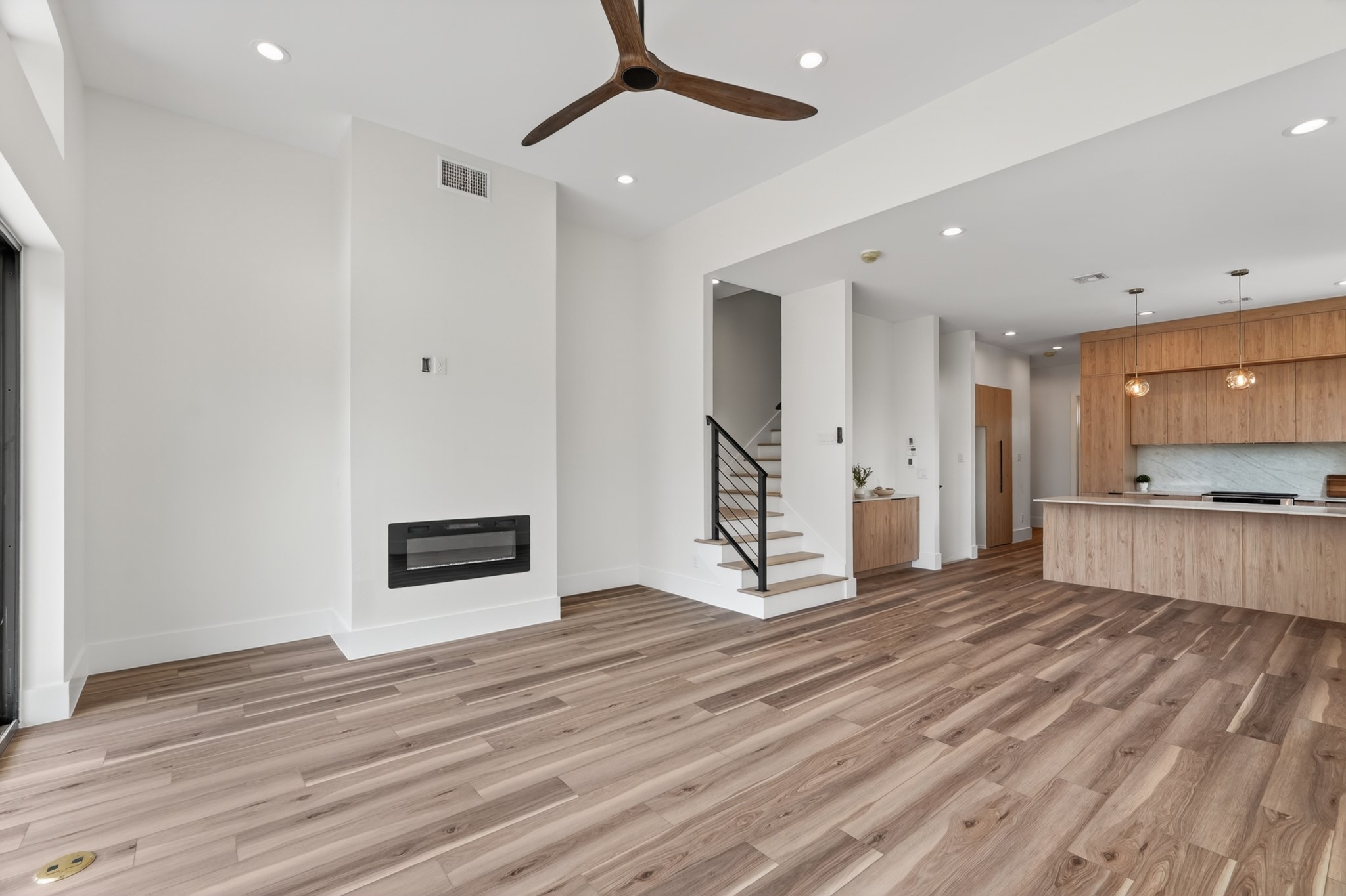 Bright and spacious living and dining space with high ceilings, large windows, and an open layout designed for effortless everyday living and entertaining.