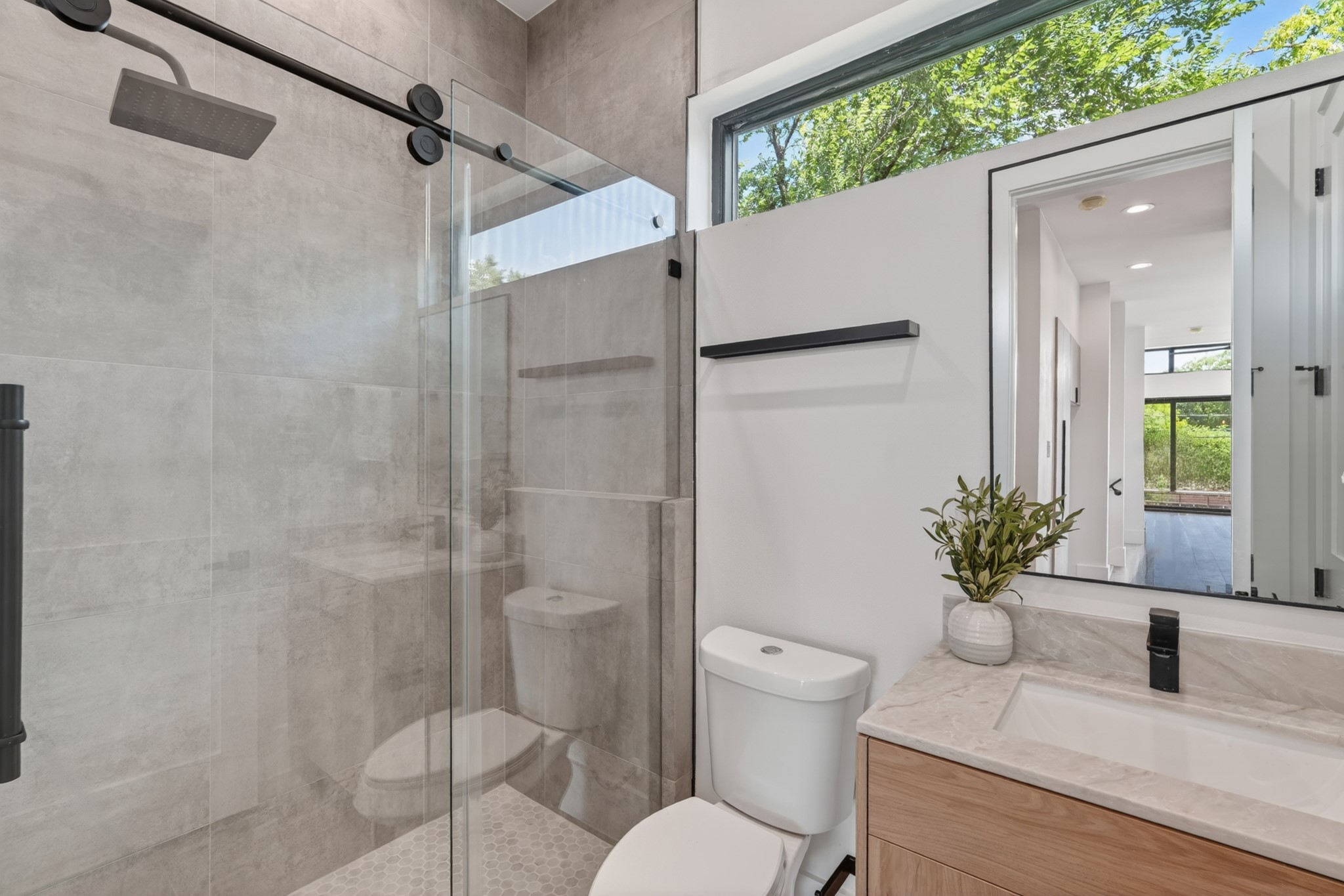 Full bathroom on the second floor with convenient guest access and private access to a secondary bedroom, making it ideal as a guest suite or home office.