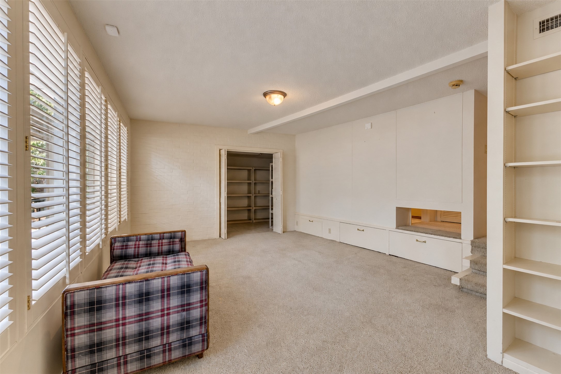 This bonus room has a full bath and large storage closet.