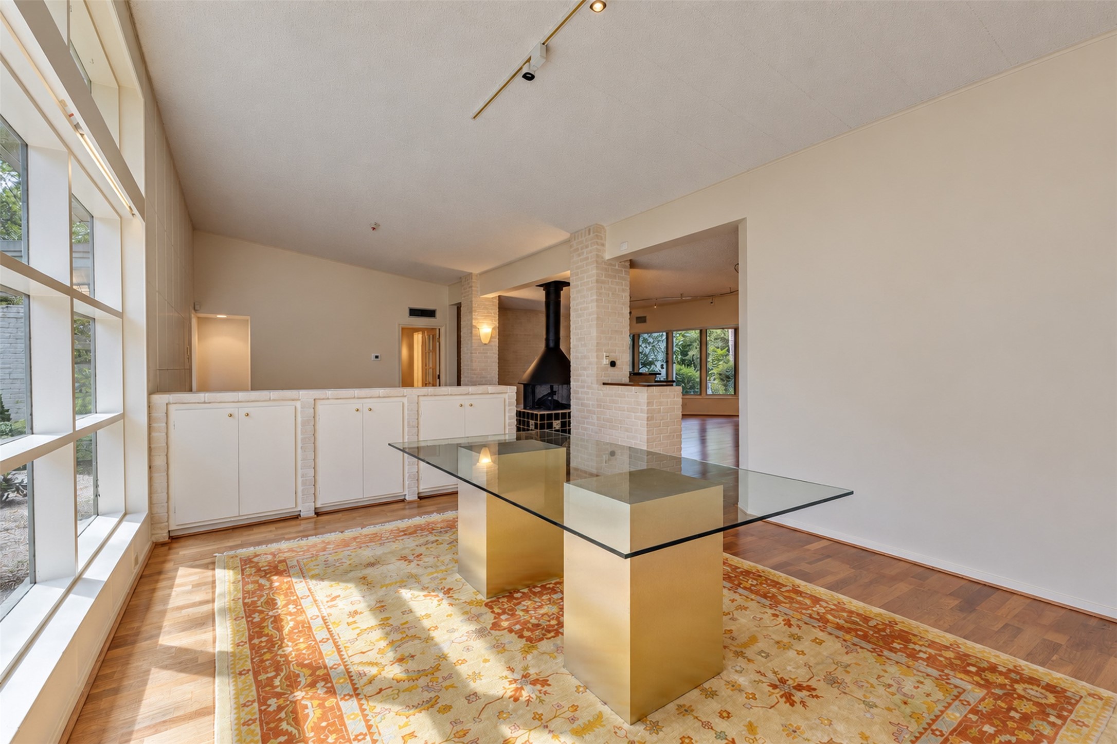 The dining room is at the front of  the home and has gorgeous lighting and high ceilings.