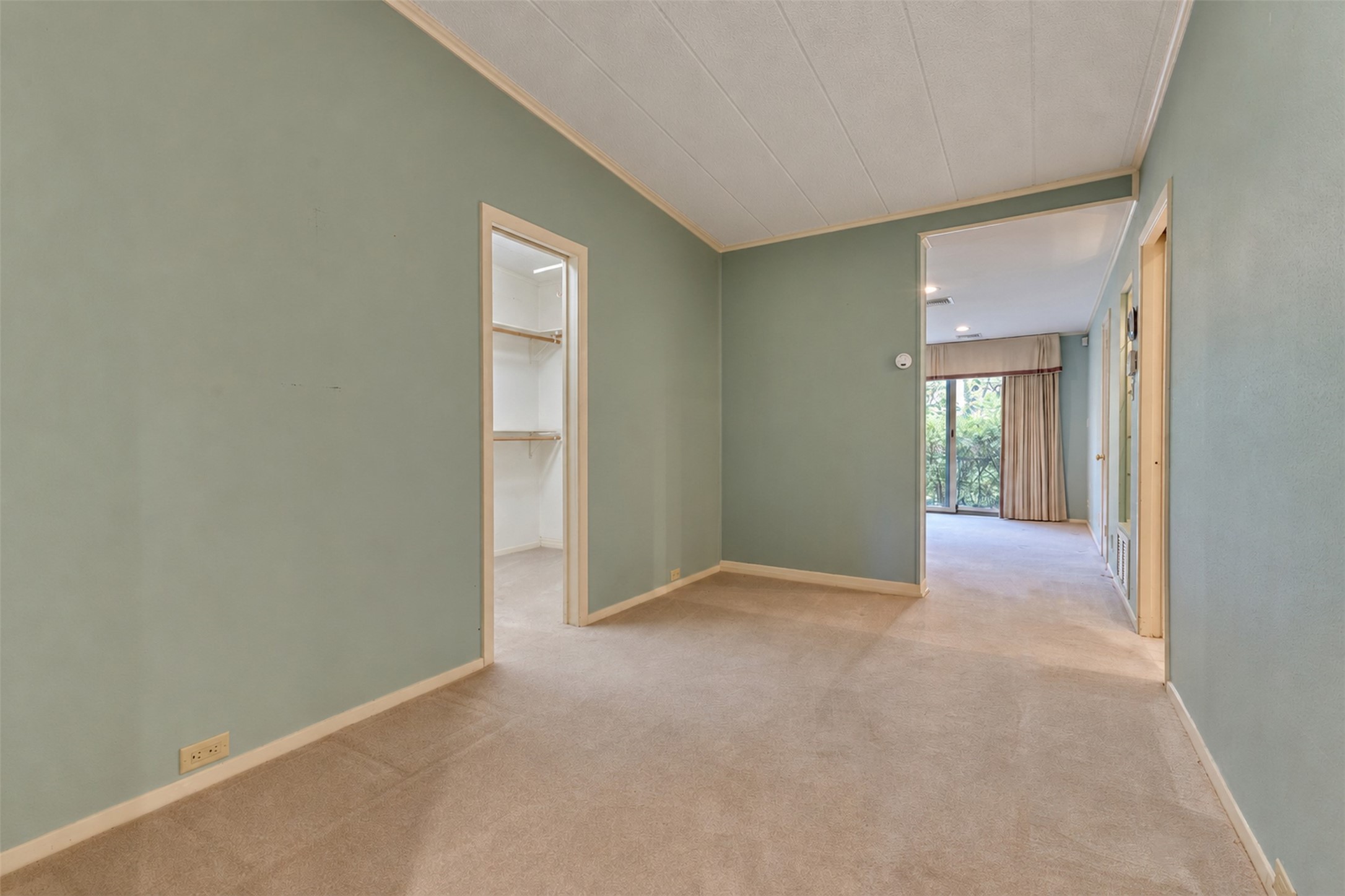 The master suite has an additional seating area, and multiple closets.