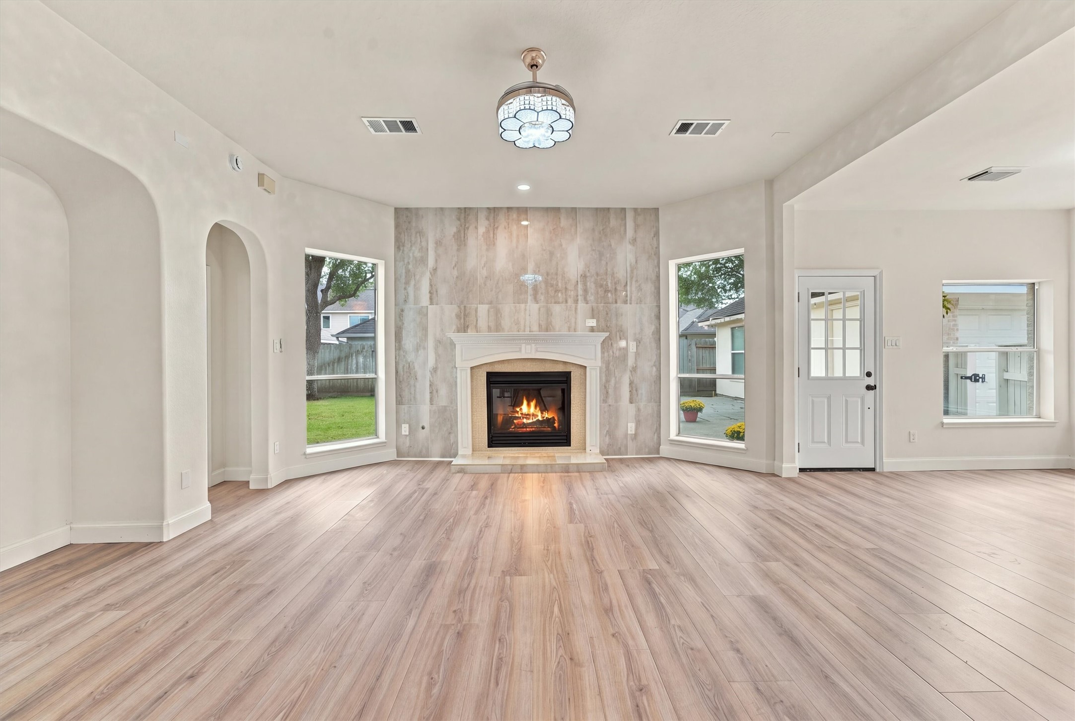 Mosaics around fireplace and decorative wall tile.