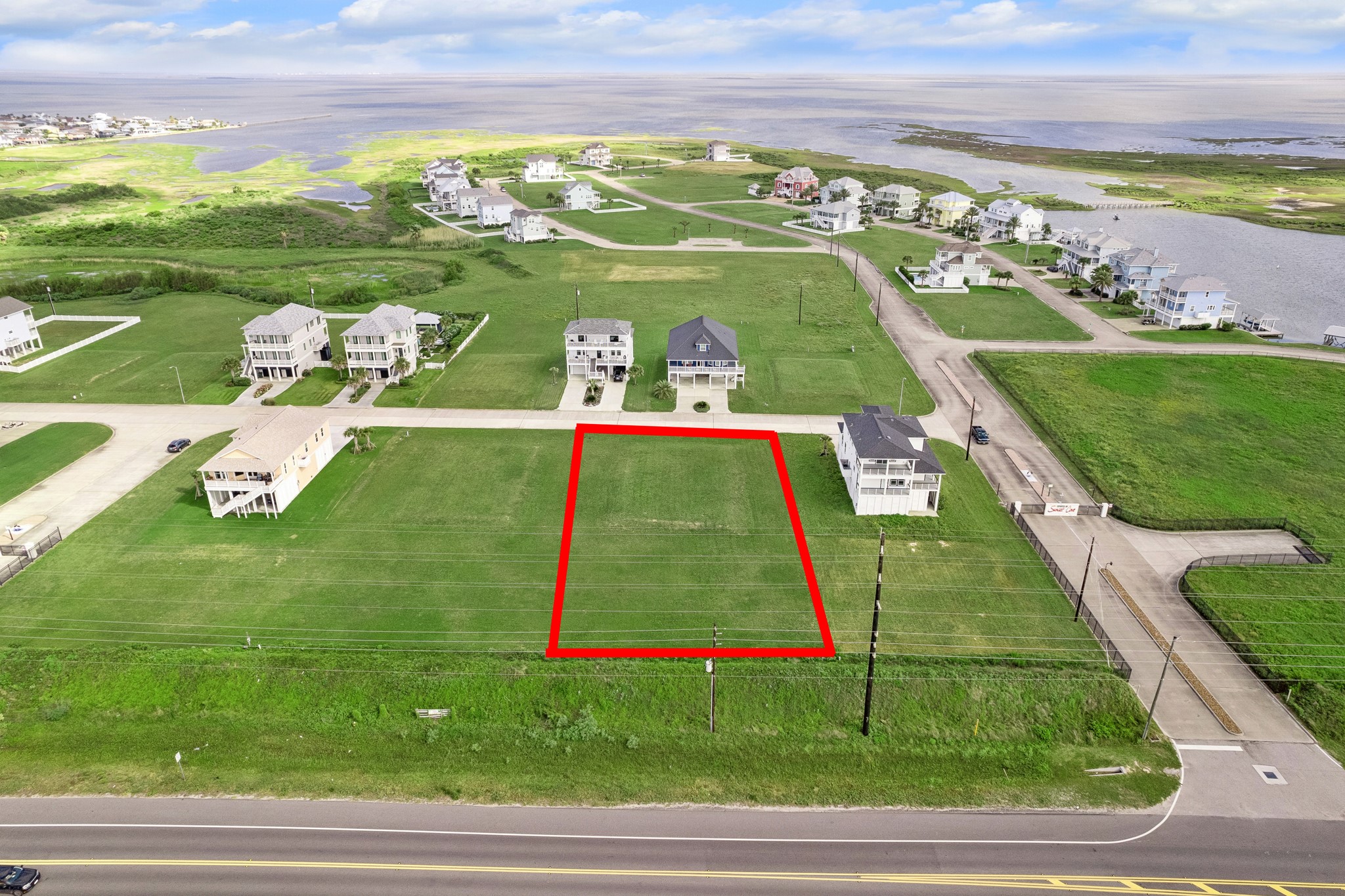 Surrounded by elevated beach houses, the setting blends privacy with a true sense of community.