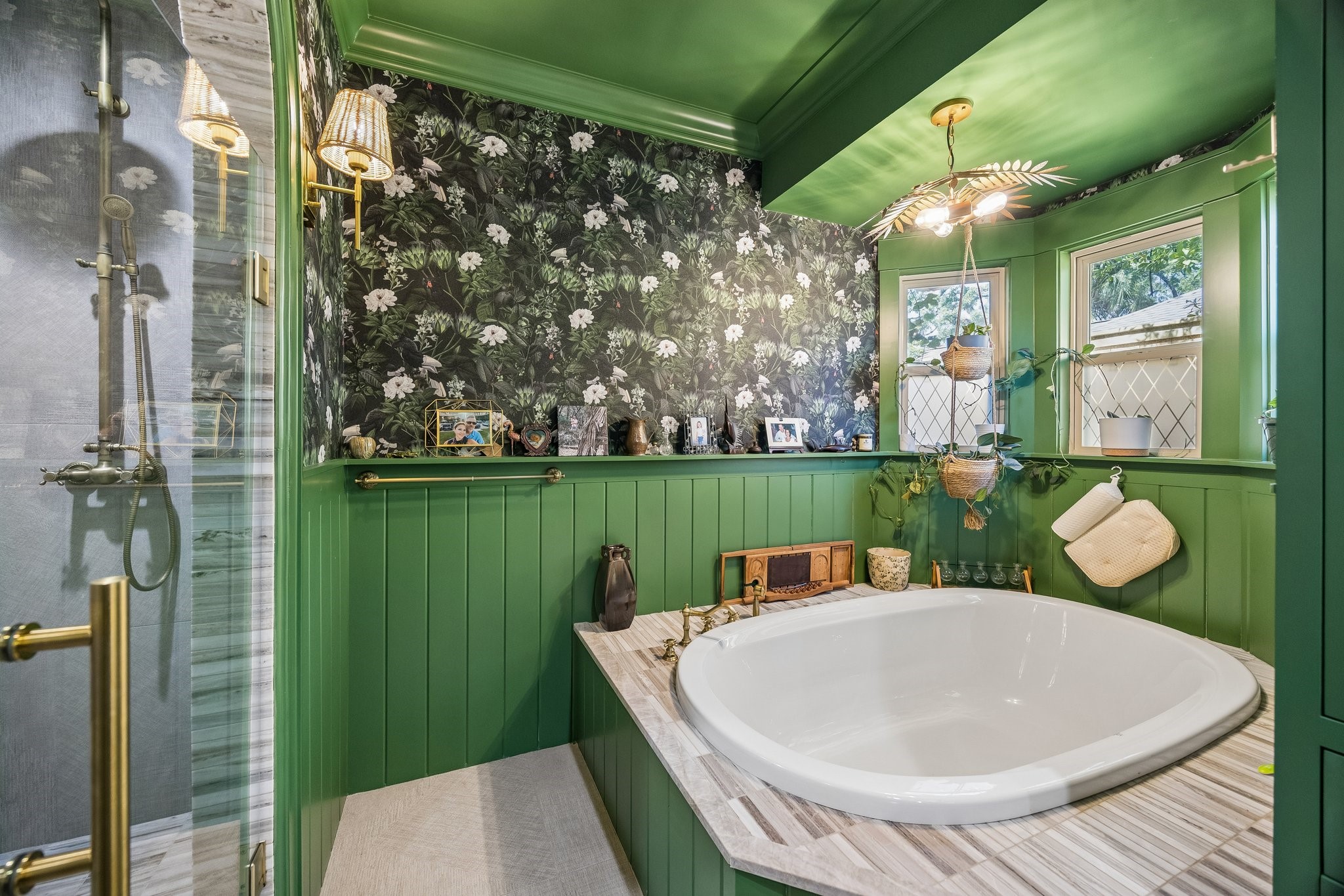 Unique forest green in the Primary Bathroom and built-in tub.