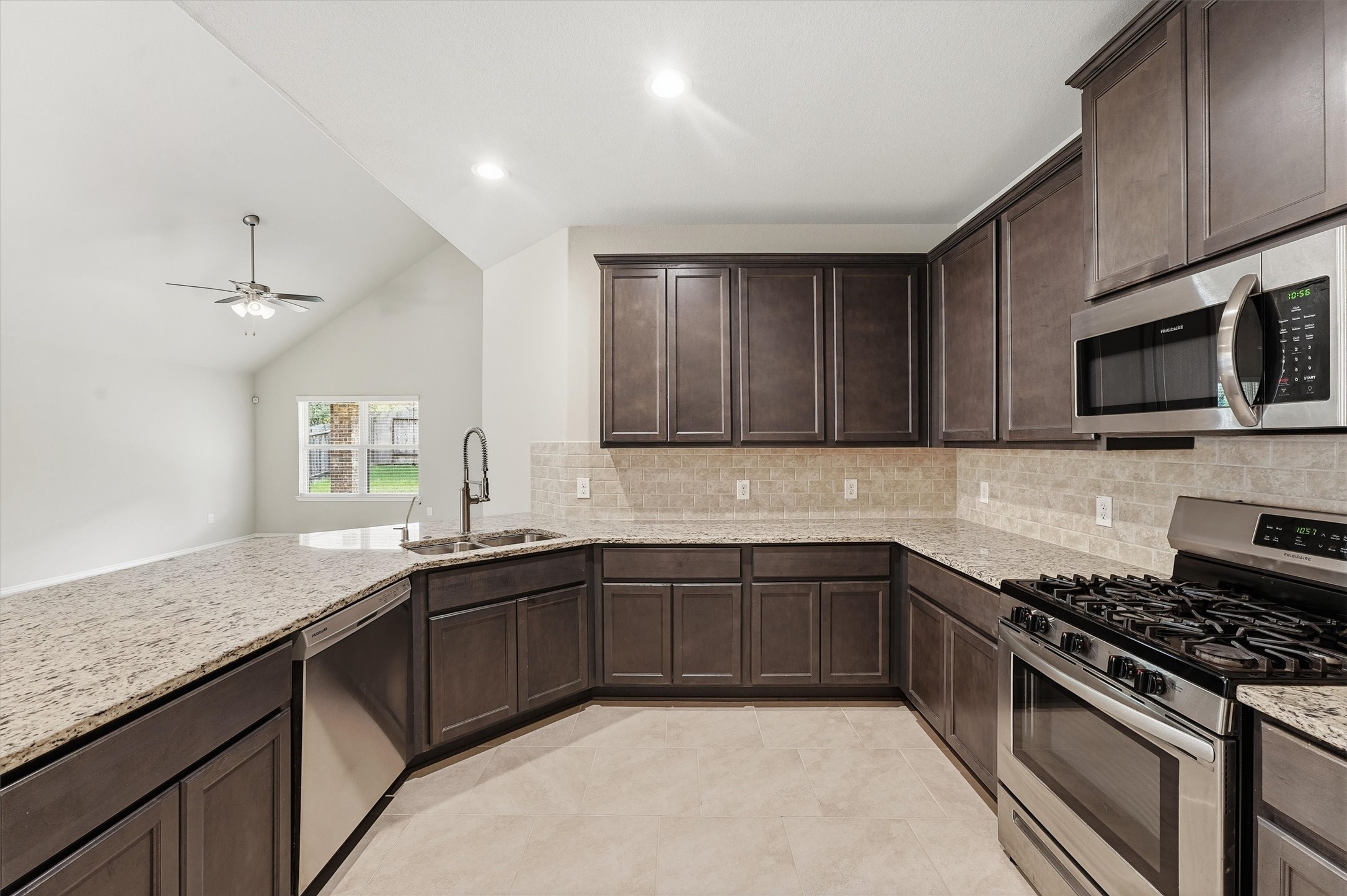 Large counter height breakfast bar open to dining area and living room. Large counter height breakfast bar open to dining area and living room.