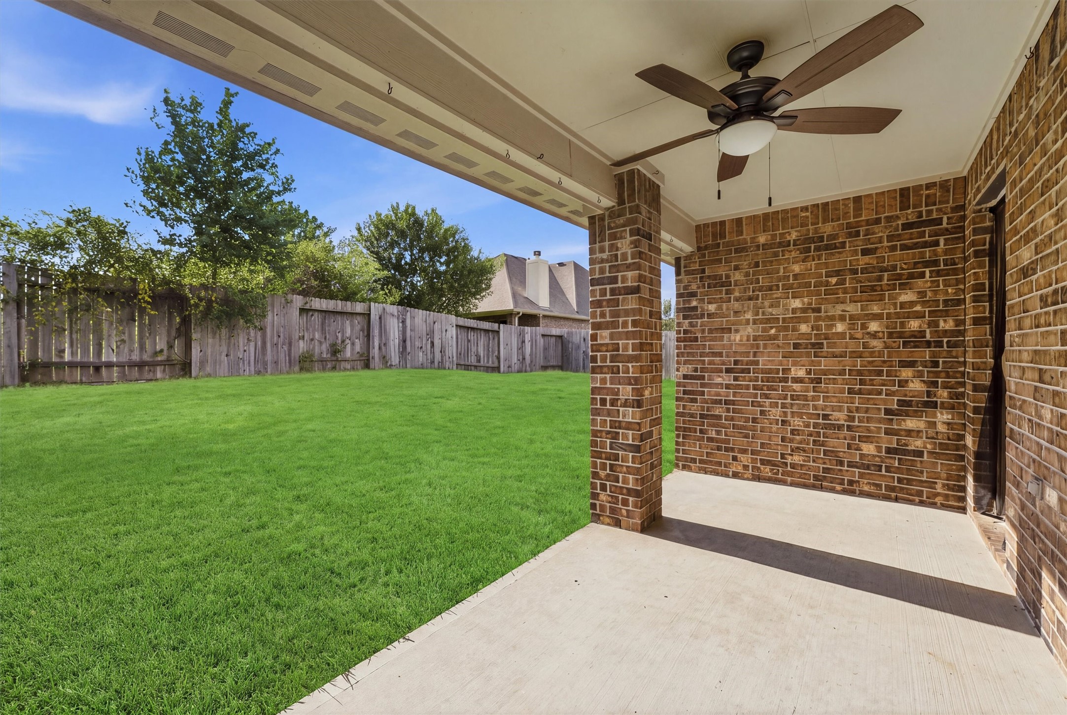 Another view of back porch with fan.