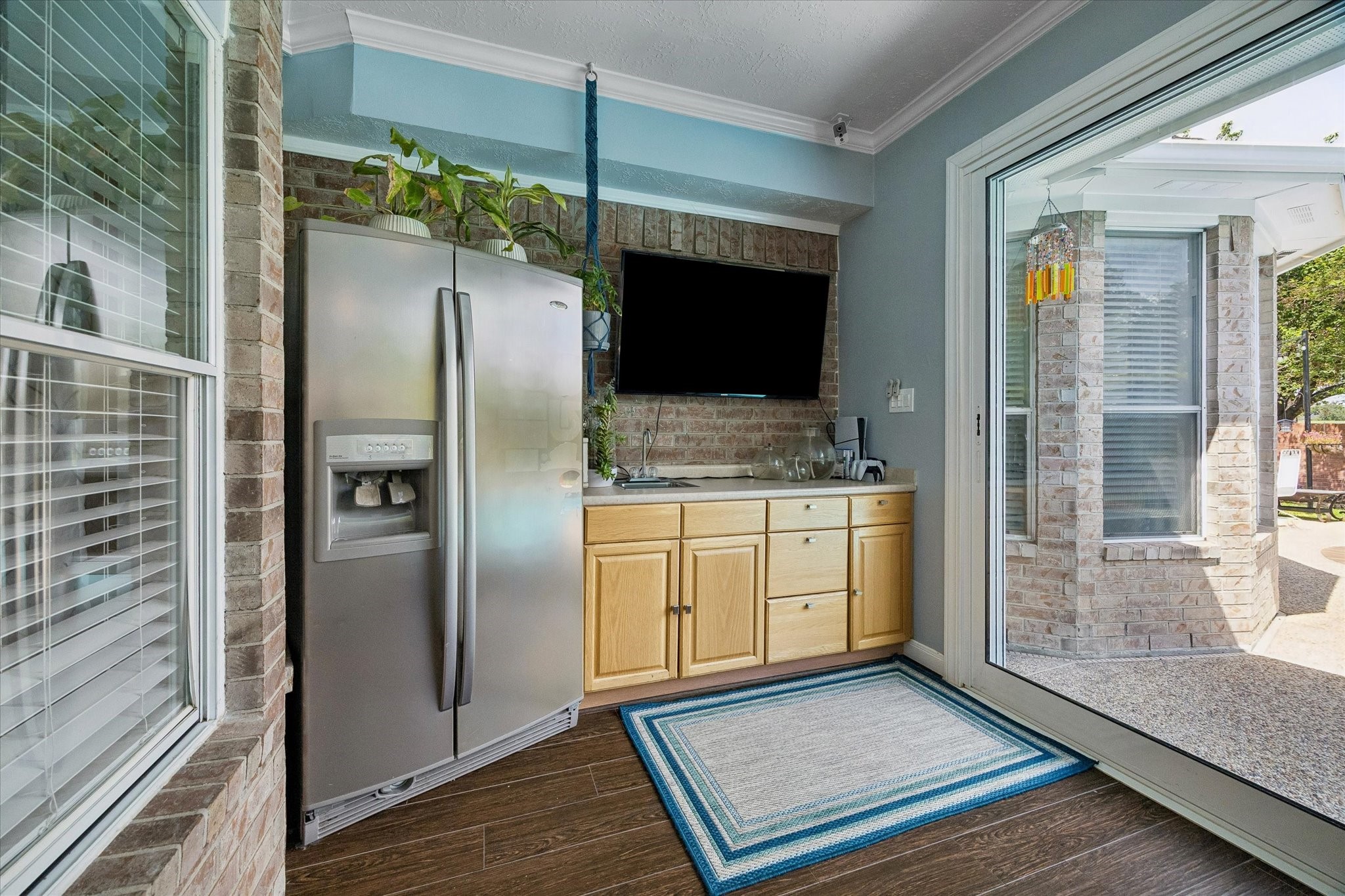 The sun room also includes a wet bar.