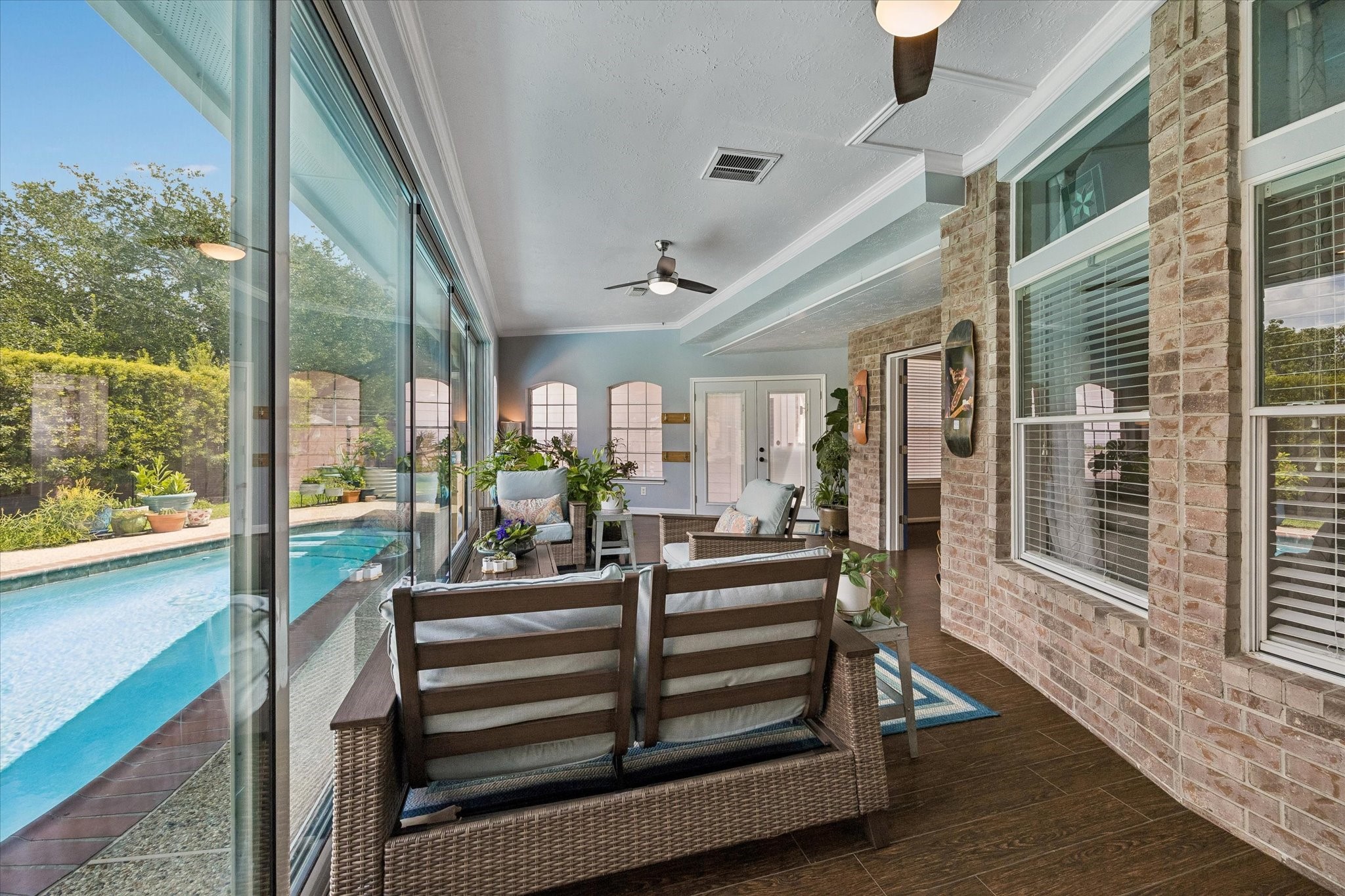 Another view of the sun room and the custom sliding glass wall.