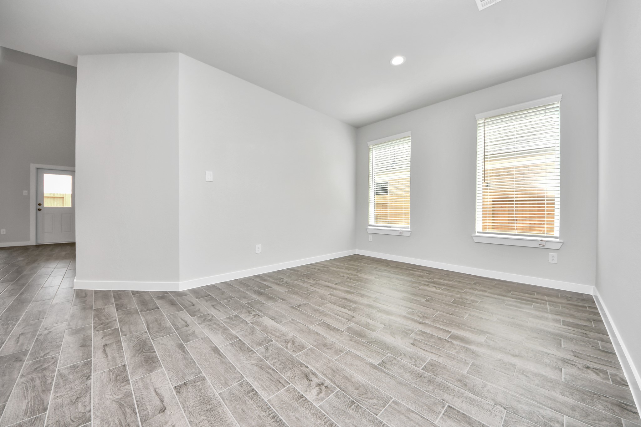 Make memories gathered around the table with your family and friends! This spacious dining room features elegant flooring, custom paint, and adjacent to family room and kitchen for open concept feel. Sample photo of completed home with similar floor plan. Actual colors and selections may vary.