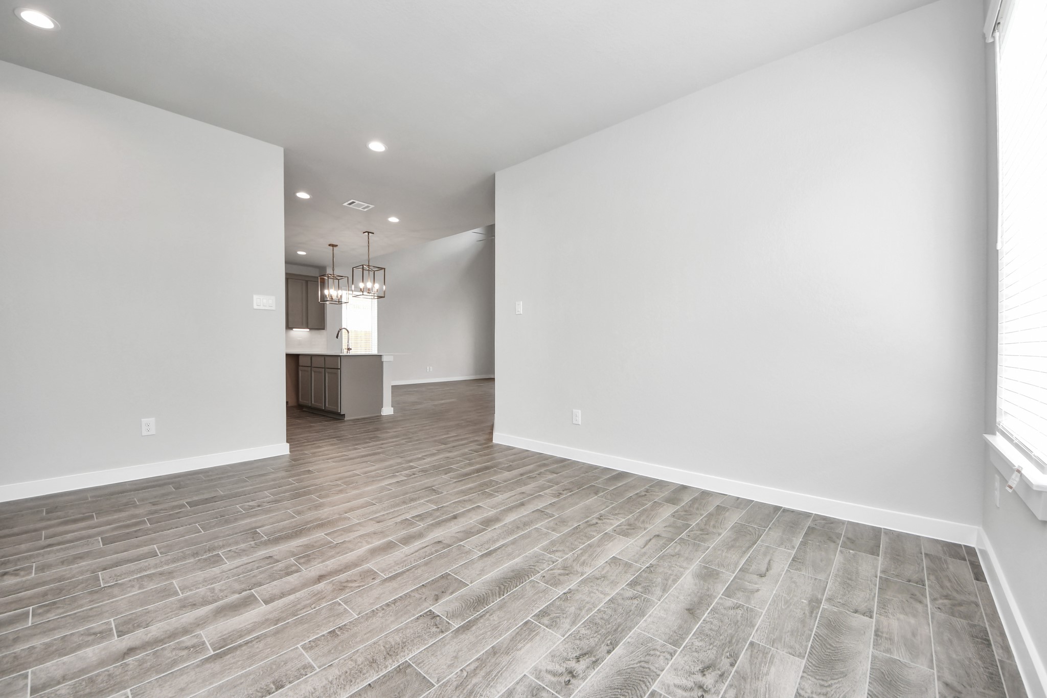 Take another look at the spacious dining area! Sample photo of completed home with similar floor plan. Actual colors and selections may vary.