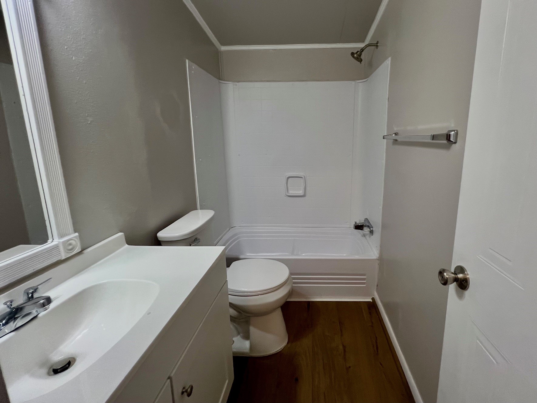 Secondary bath with new vanity and tub/shower.