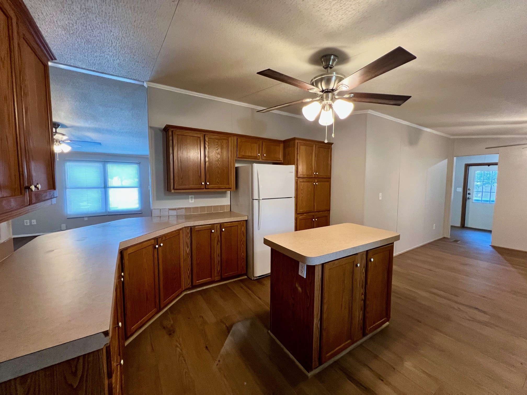 Kitchen opens to living room.
