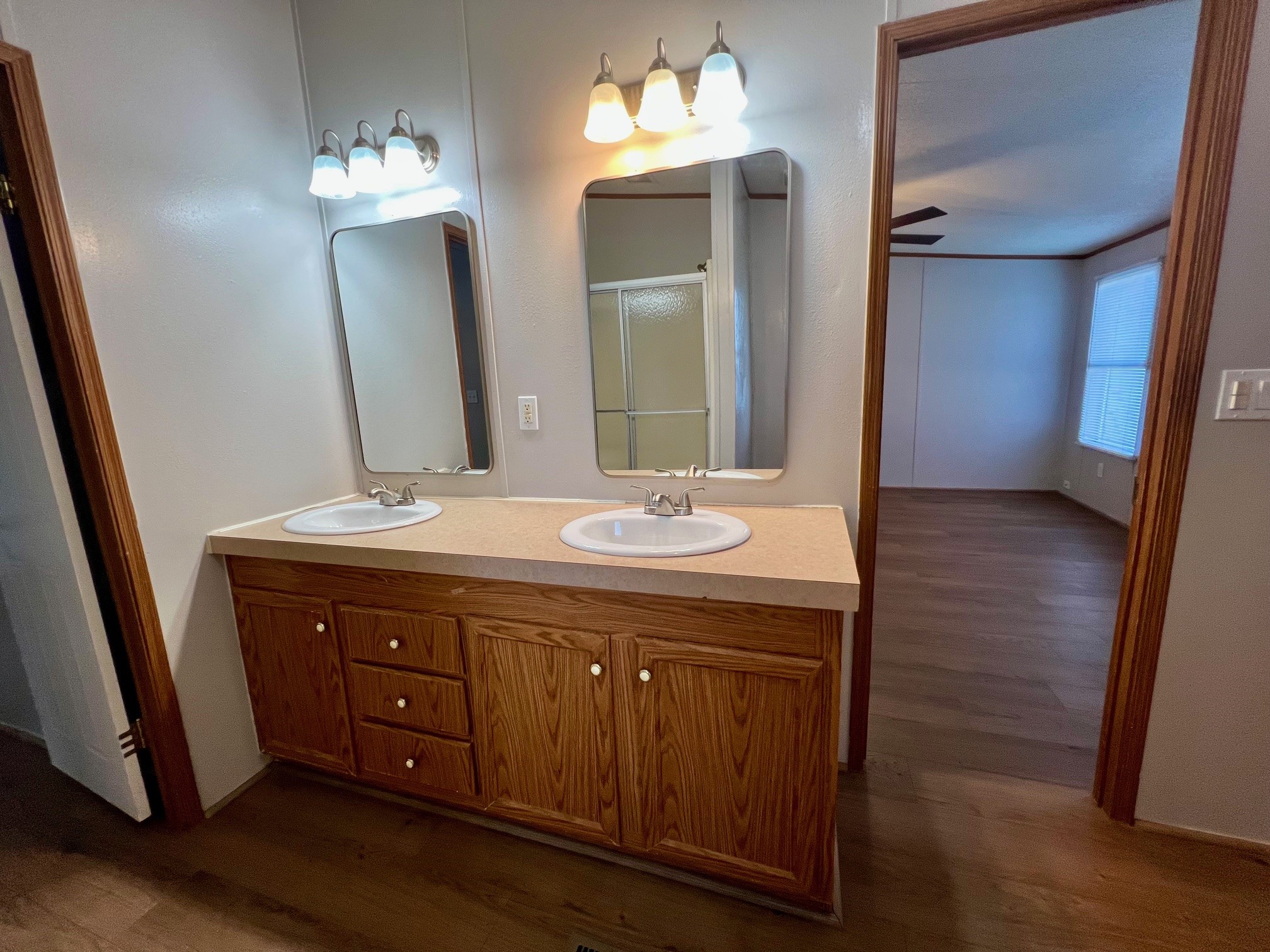 Primary bath has new sinks, faucets, and mirrors.