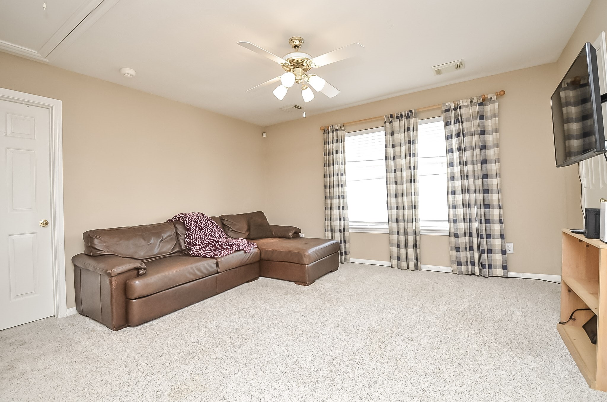 Upstairs game room perfect for entertaining.