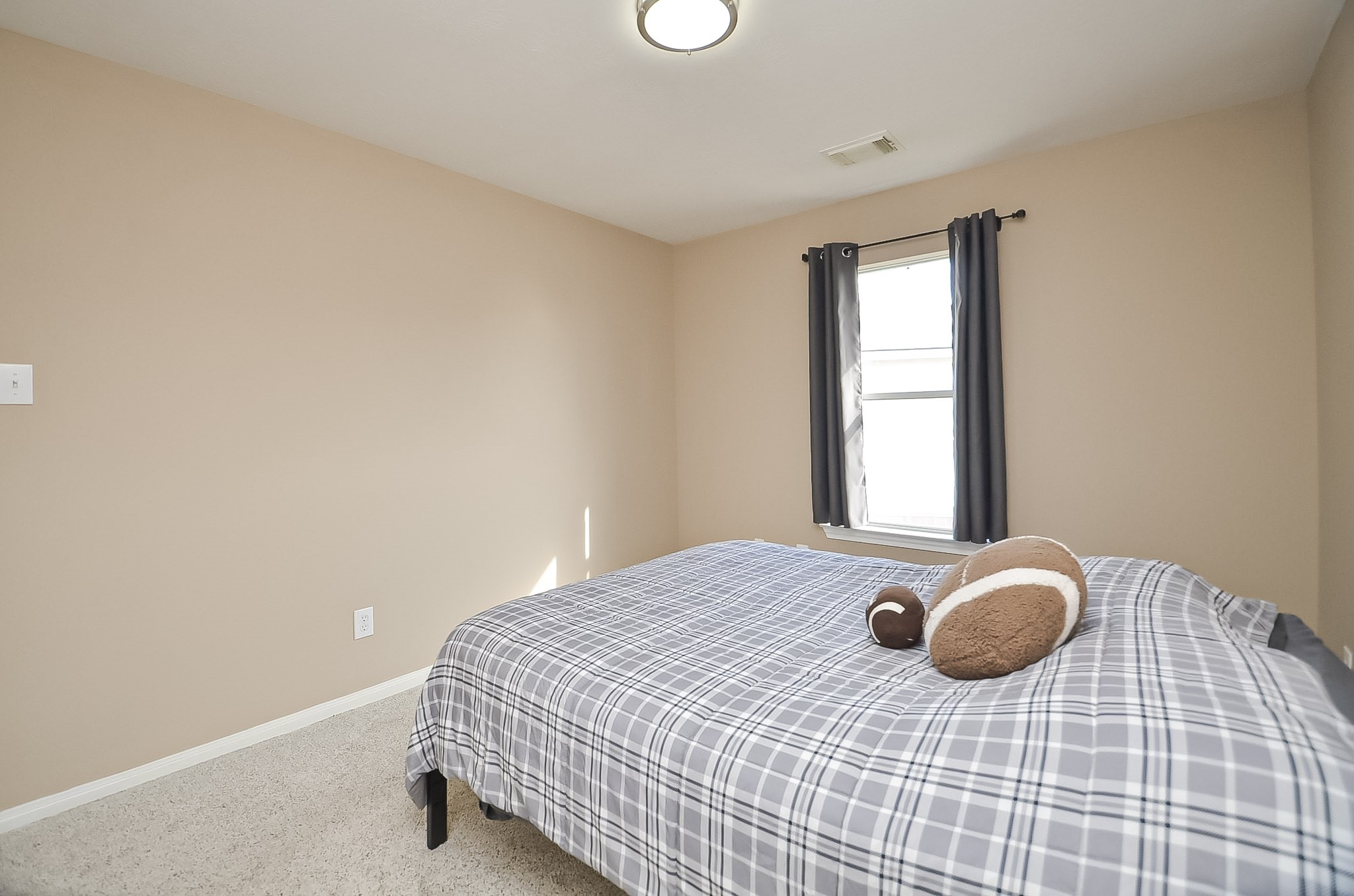 One of the upstairs two secondary bedrooms. Freshly painted.