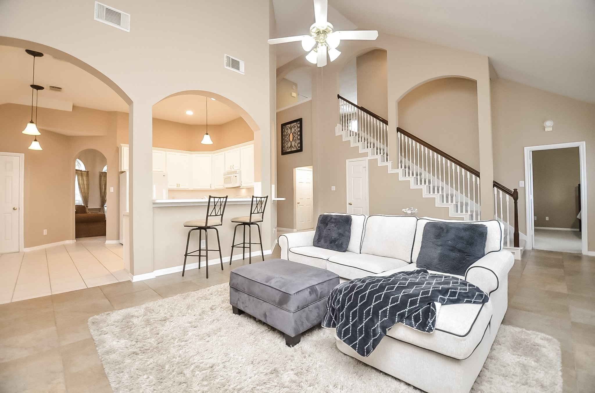 The open kitchen seamlessly connects to the family room, perfect for effortless entertaining.