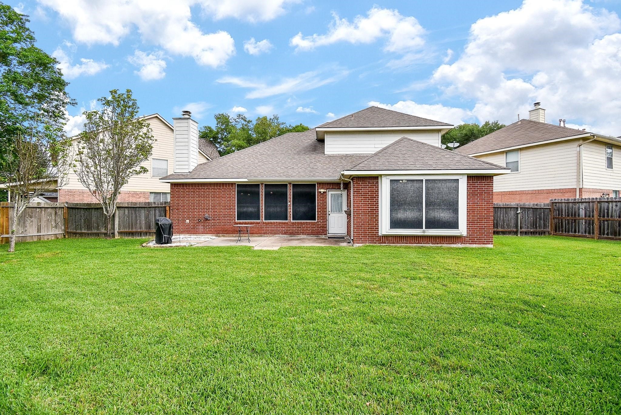 Expansive backyard perfect for barbecues and entertaining family and friends.
