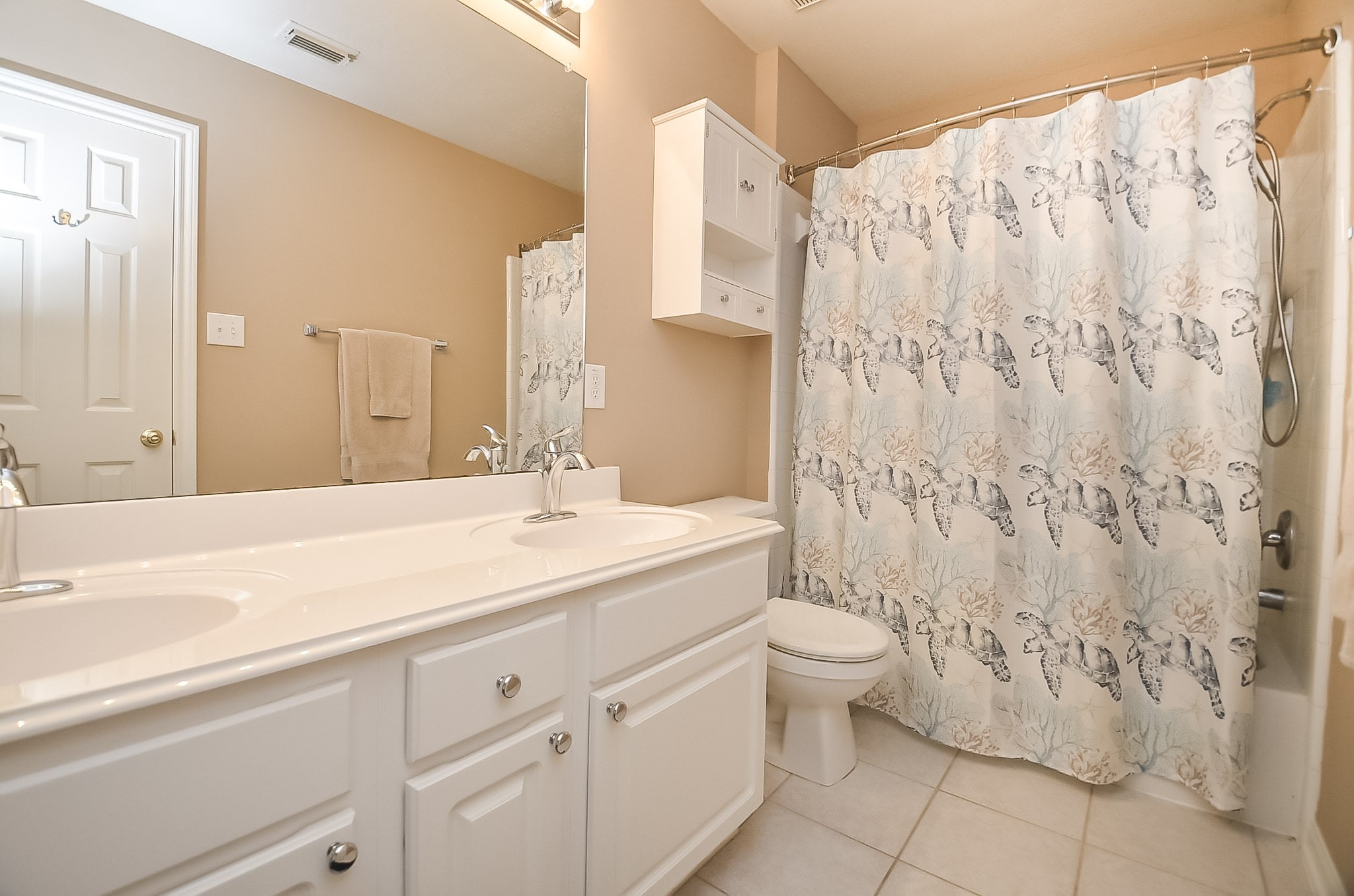 Upstairs bathroom with dual vanities.  Freshly painted.