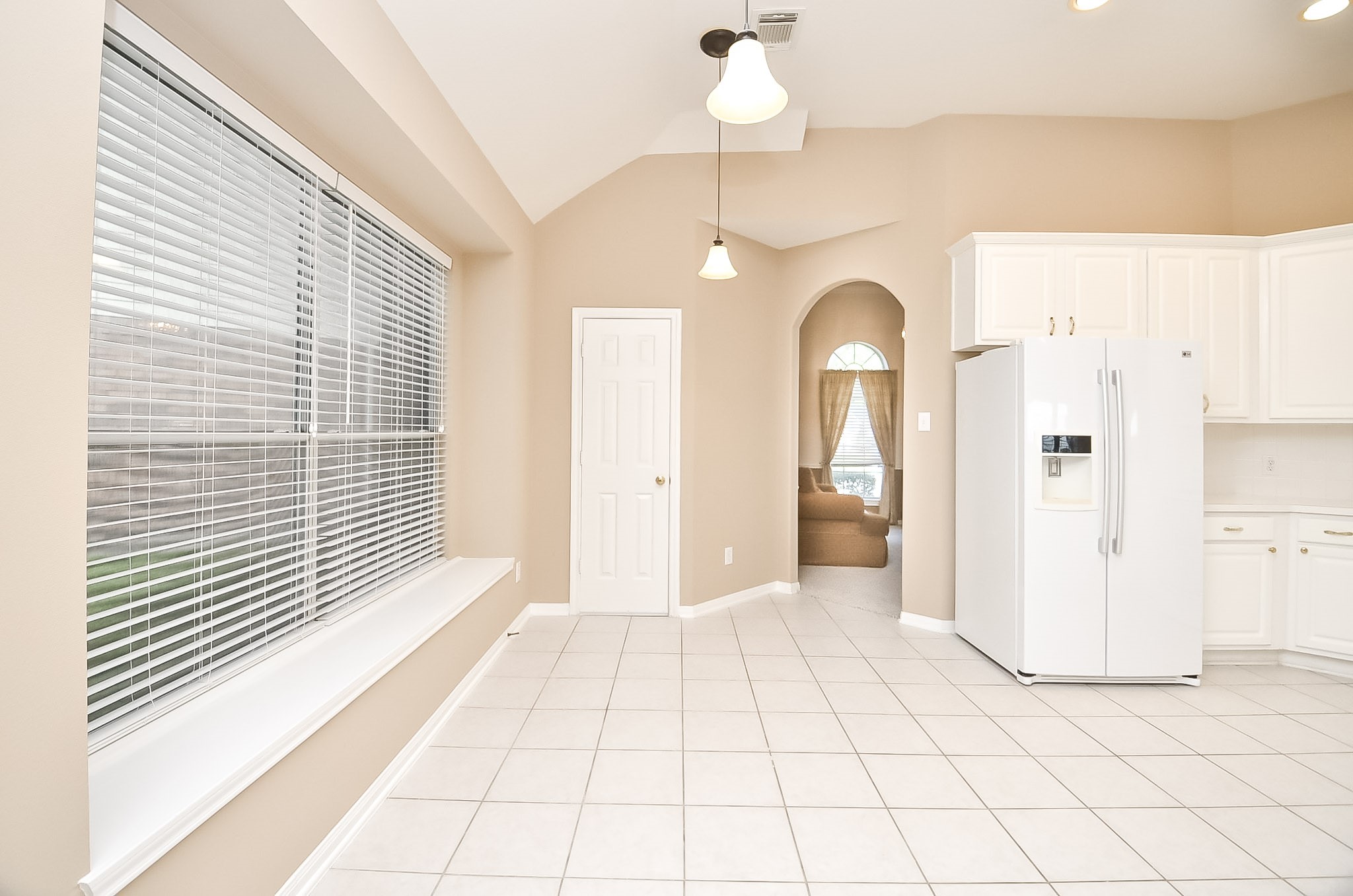 Enjoy a cozy dining area right in the kitchen.  There is also a pass through to the formal dining.  There is also a window seat in the kitchen.