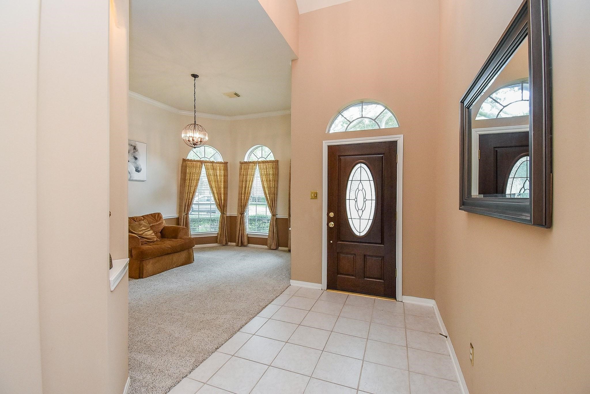 View to the front door with your formal dining room to your left.