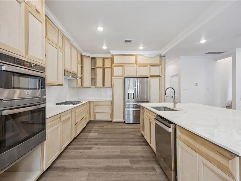 Kitchen & Appliances  Renovated kitchen features custom cabinetry, stainless-steel appliances, gas cooking, expansive countertops, and abundant storage. Final cabinetry and finishing work are still underway.