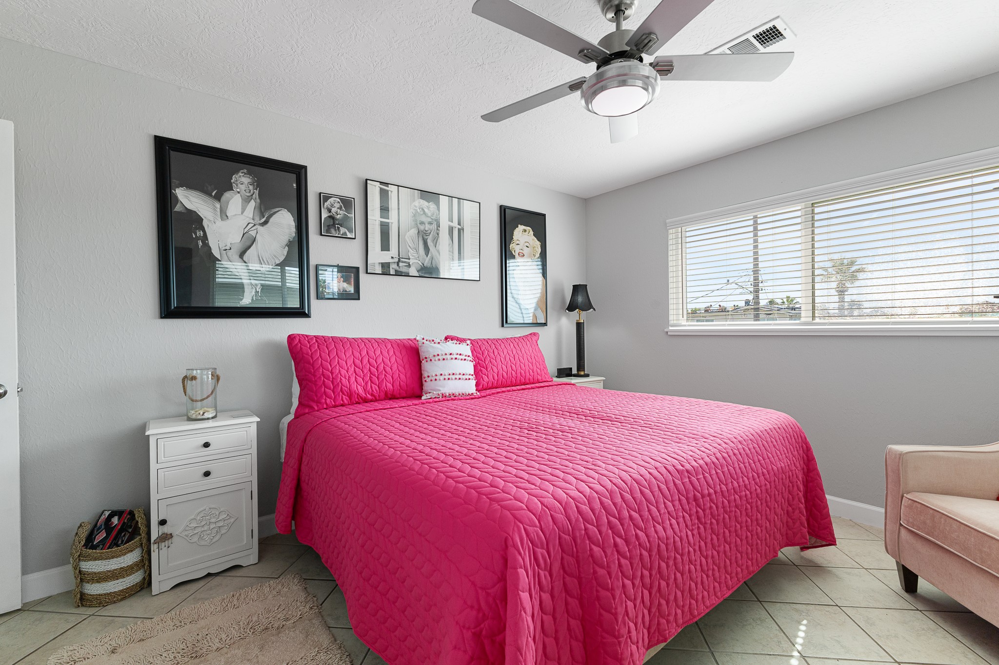 Additional view of the bedroom showcasing its generous size and natural light.