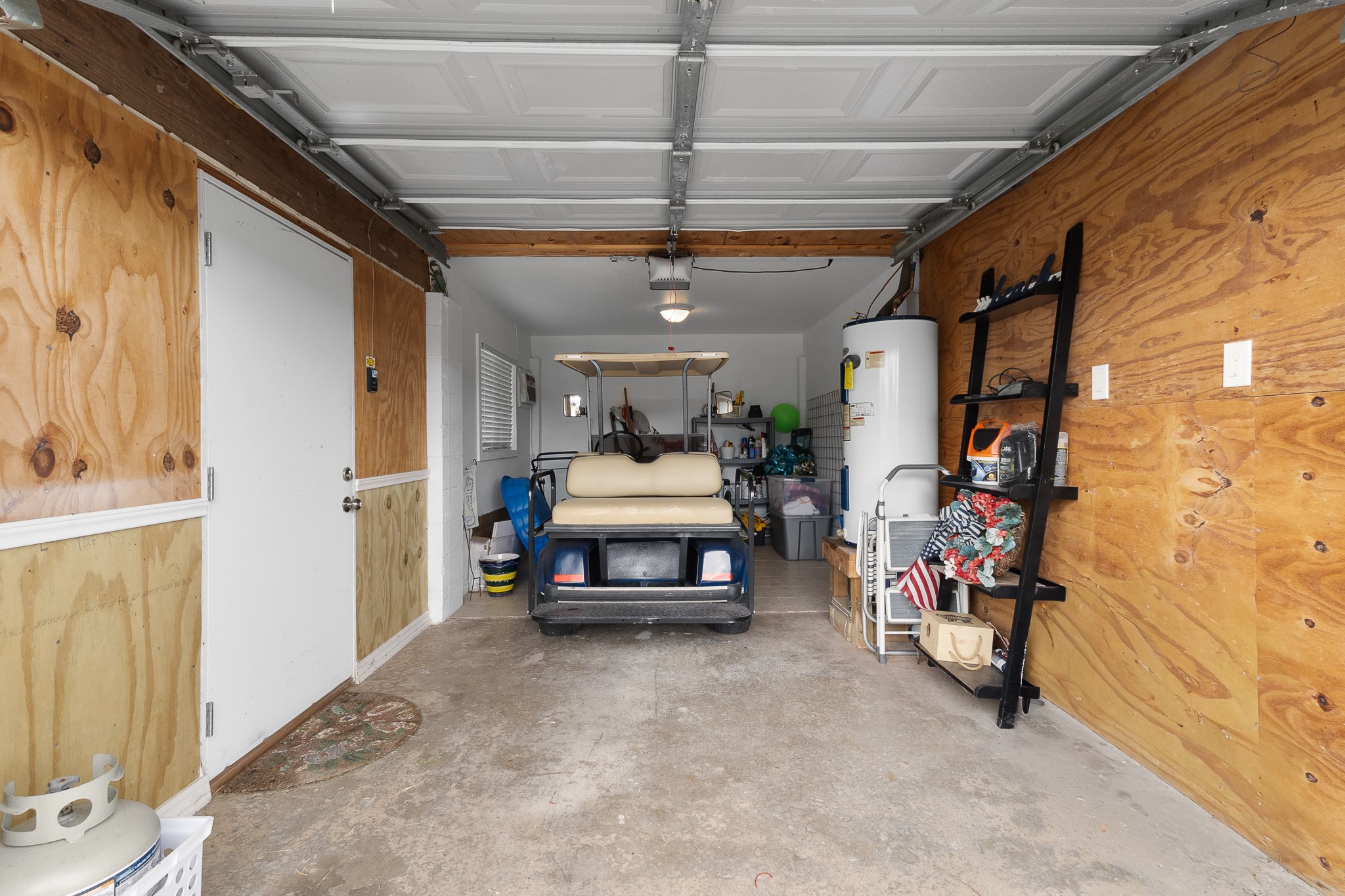 Garage provides convenient storage for the golf cart and all the extras that come with coastal living.