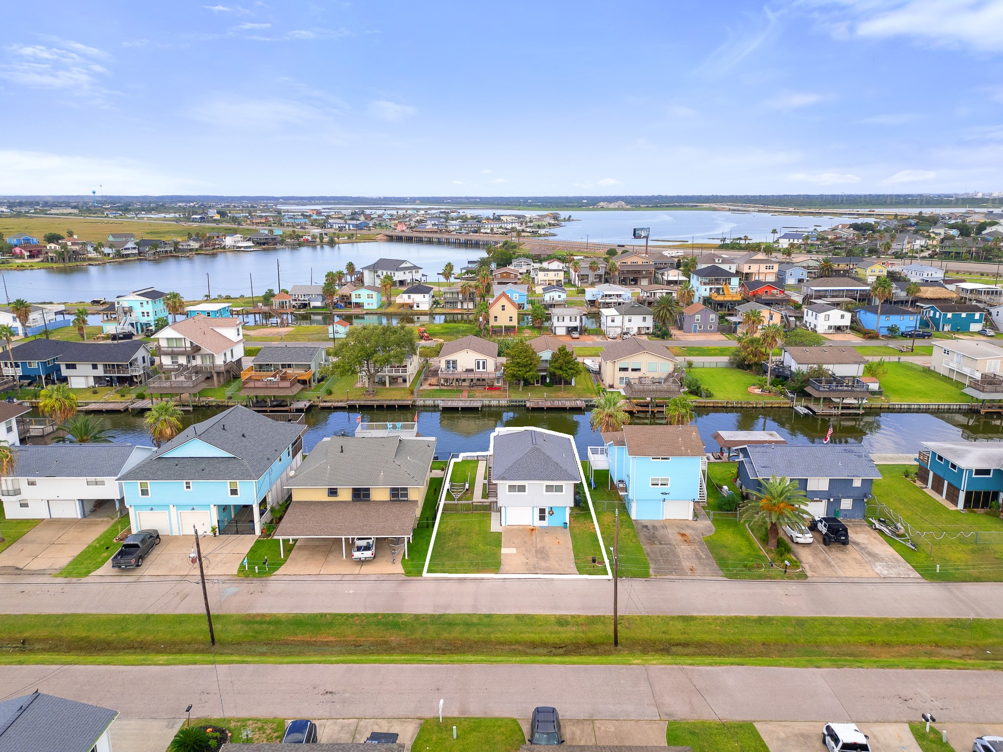Aerial view highlighting the propertys location along the canal.