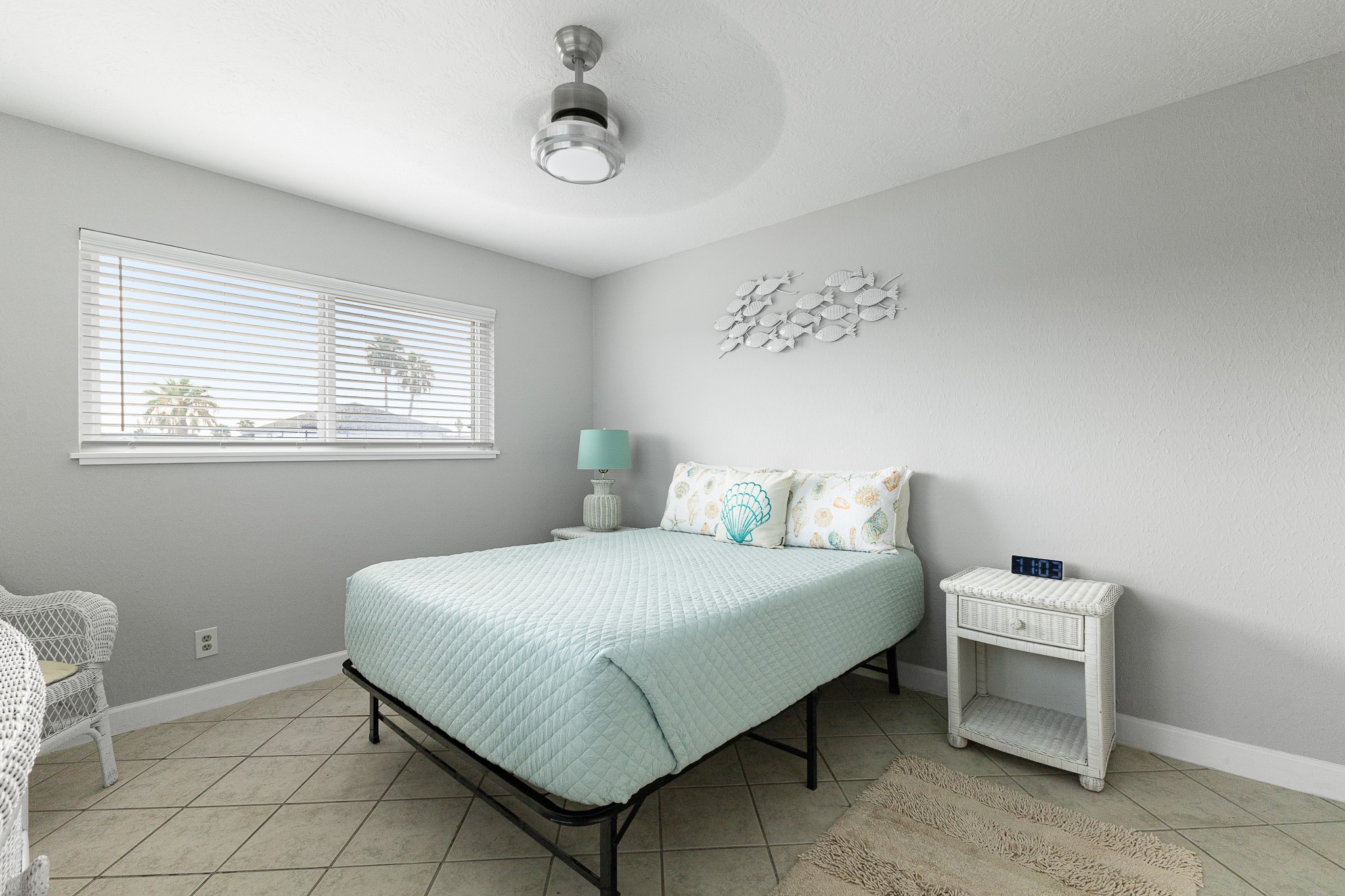 Comfortable second bedroom with a light coastal feel.