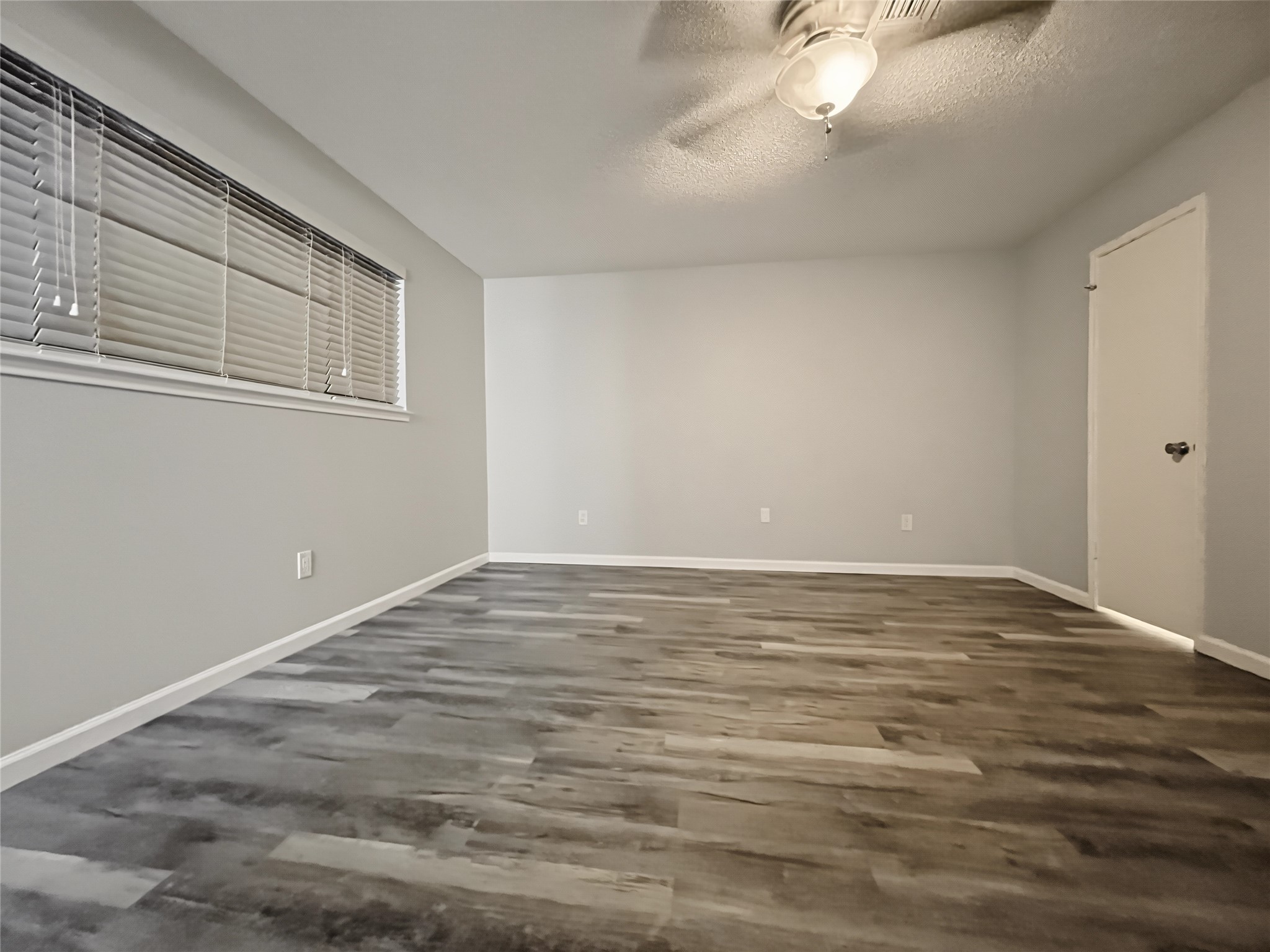 Another view of the primary bedroom.