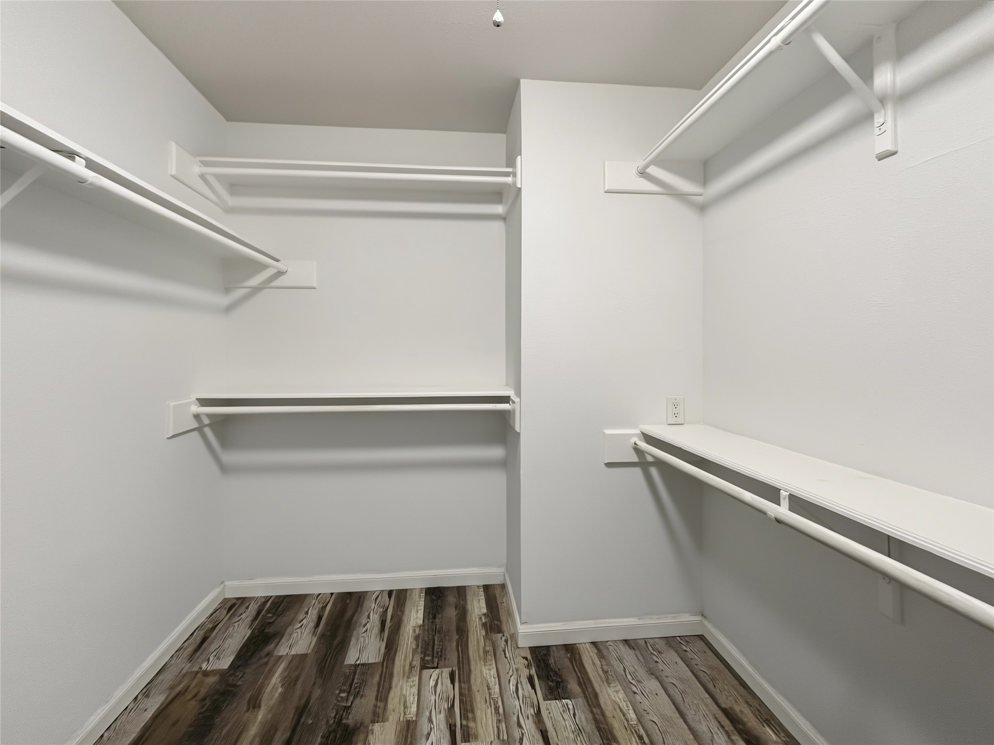 View of the spacious walk-in closet inside the primary suite.