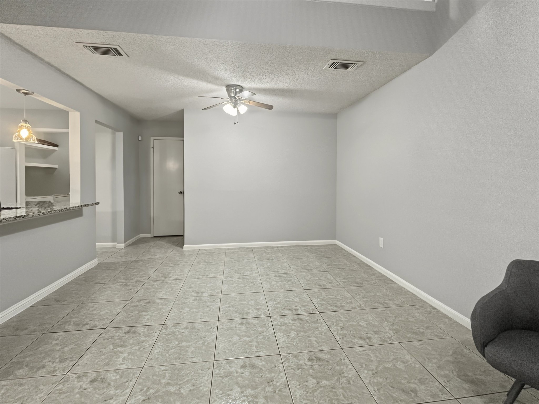 Great view of the open kitchen to the dining and living room areas.