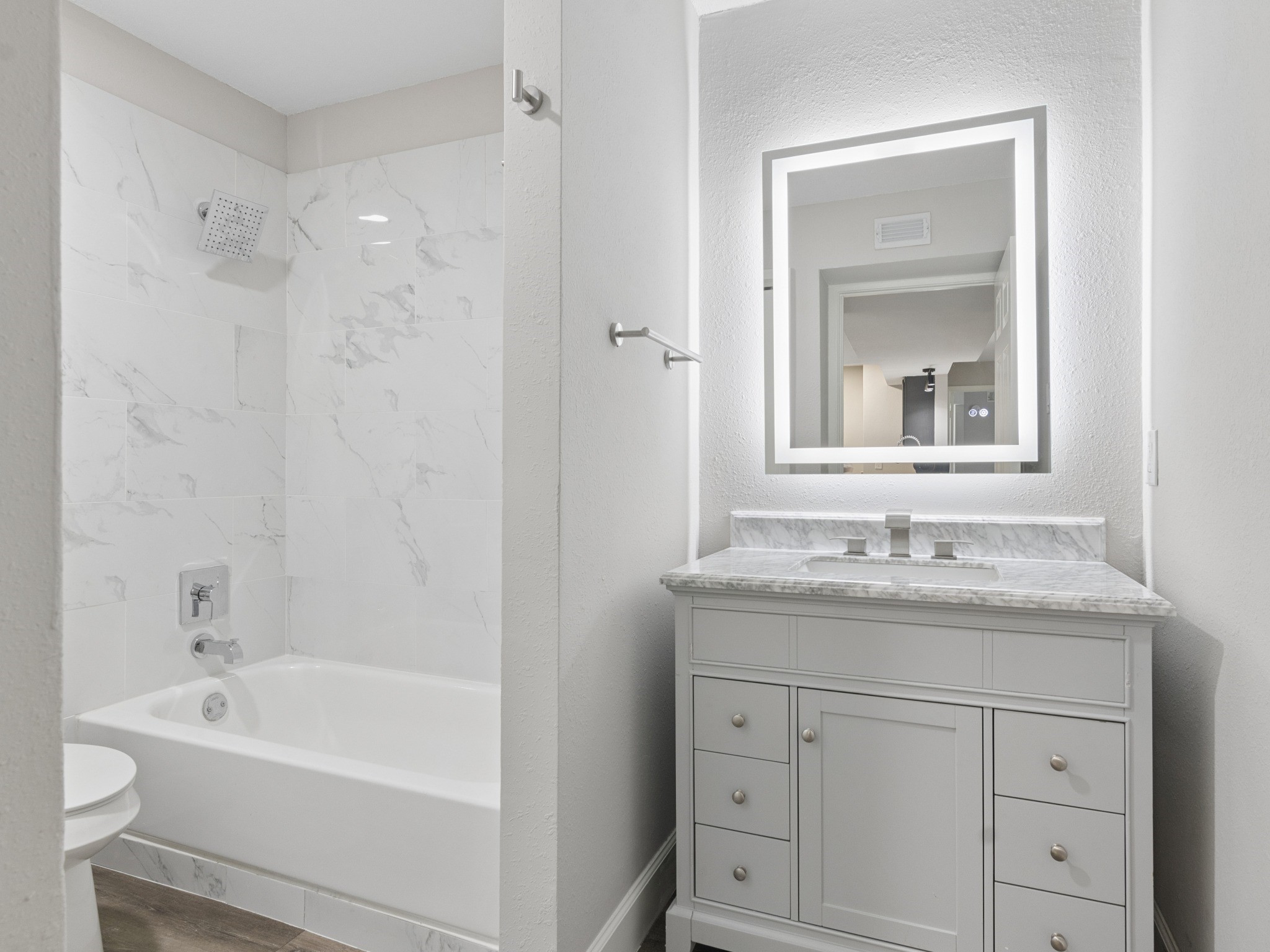 Second bathroom with tub/shower combo.