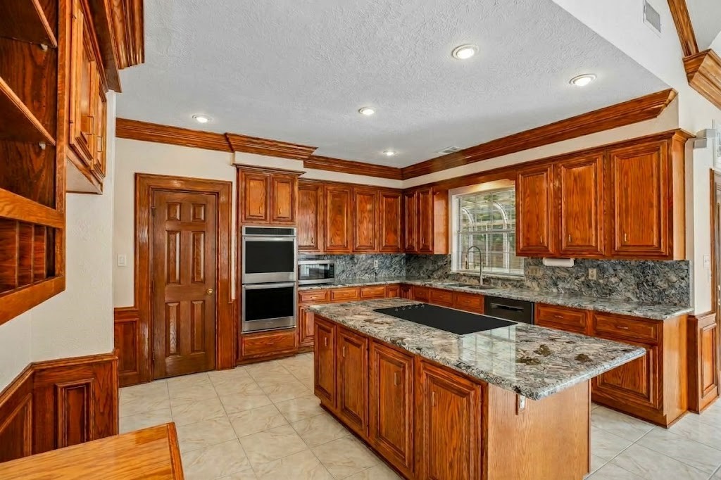 Spacious kitchen with double ovens and