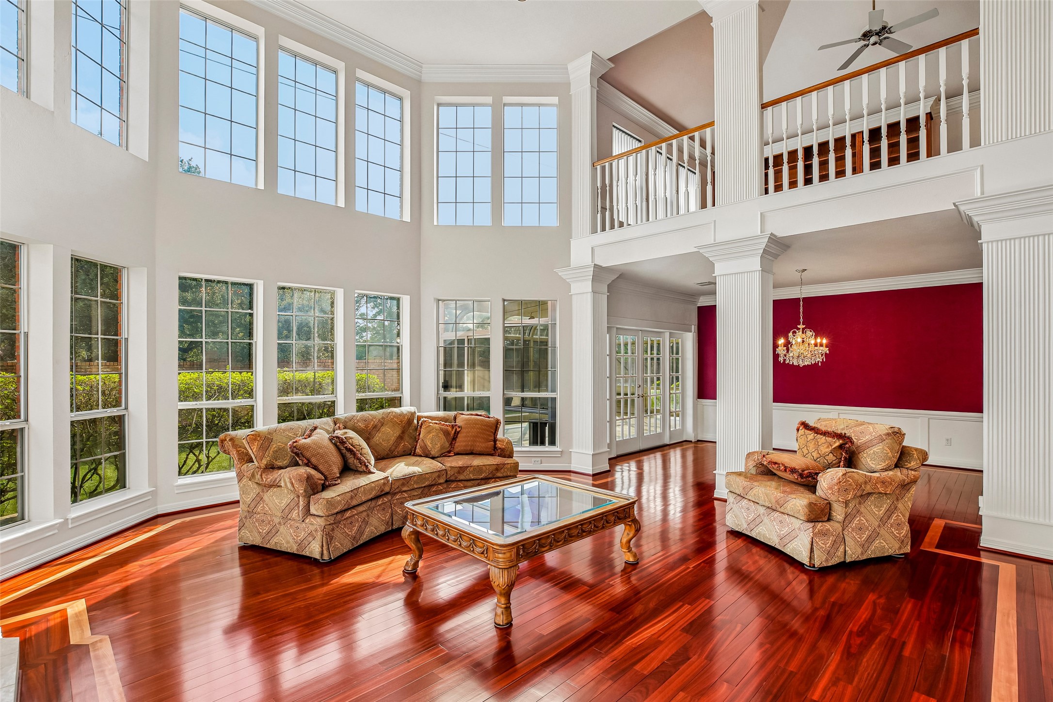 High ceiling in living room with a vast amount of natural sunlight throughout