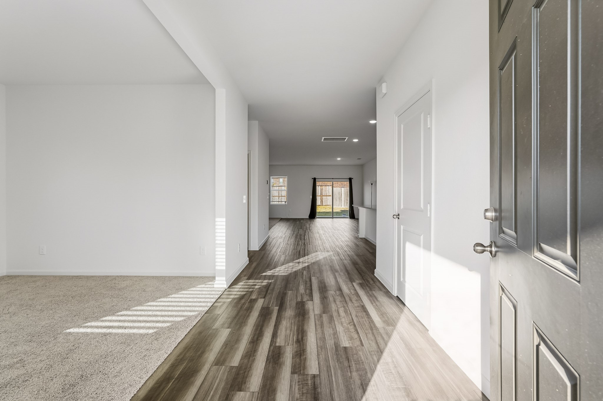 This bright and welcoming entryway creates an inviting first impression with its spacious, open-concept design and seamless flow into the home's main living areas. This bright and welcoming entryway creates an inviting first impression with its spacious, open-concept design and seamless flow into the home's main living areas.