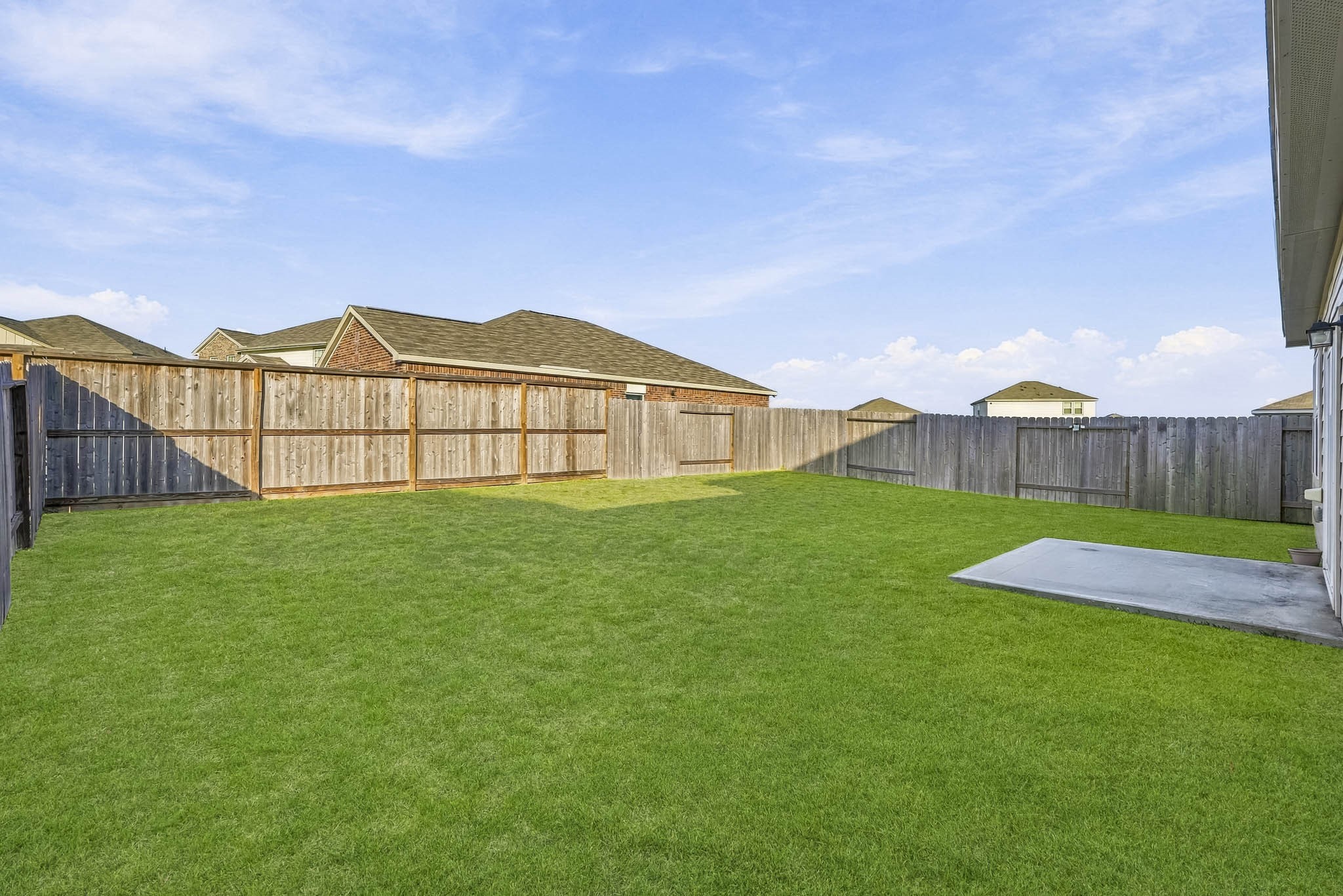 With plenty of open space this outdoor area is perfect for enjoying sunny afternoons, hosting gatherings, or creating a personalized backyard oasis.