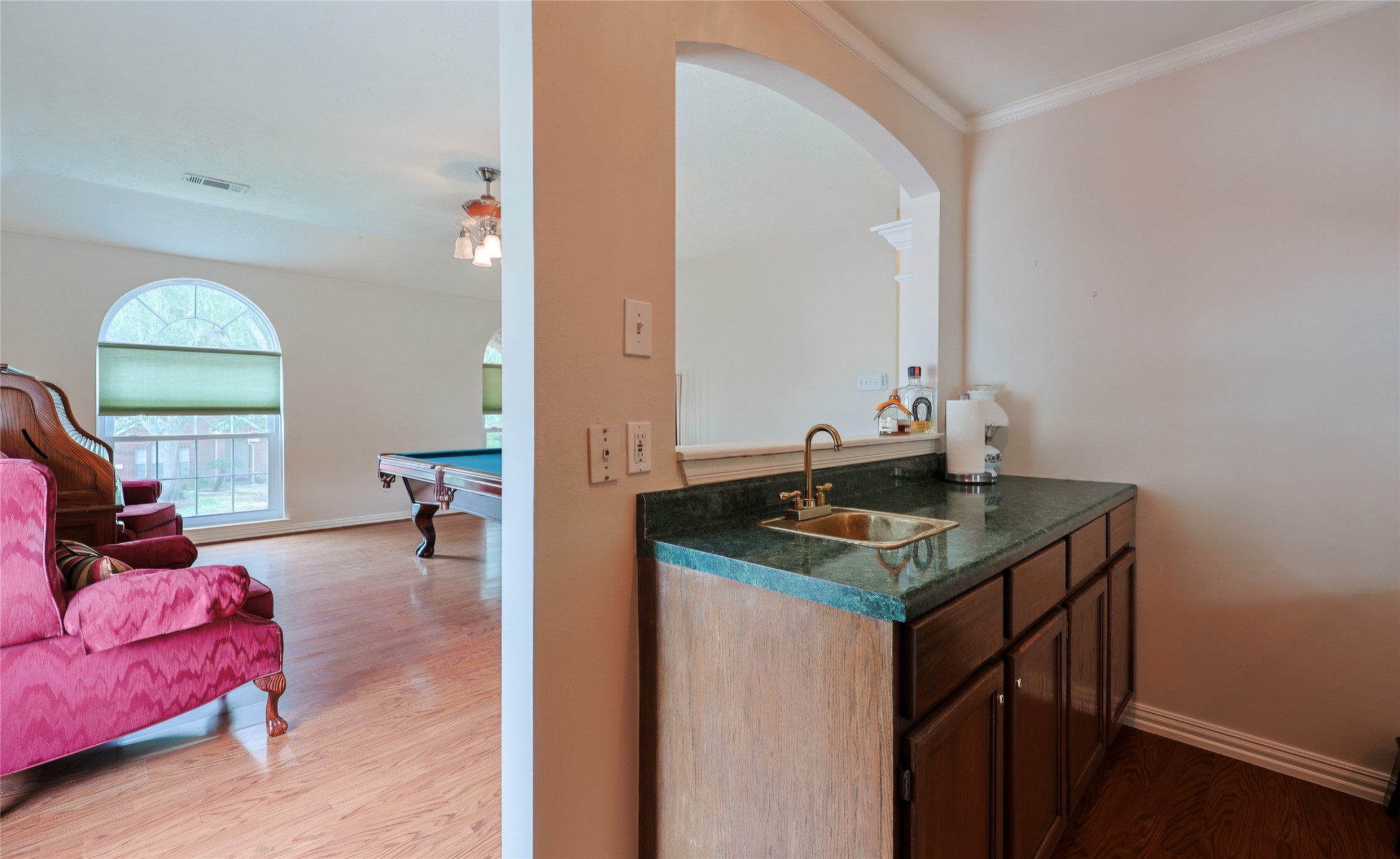 Wet bar open to gameroom