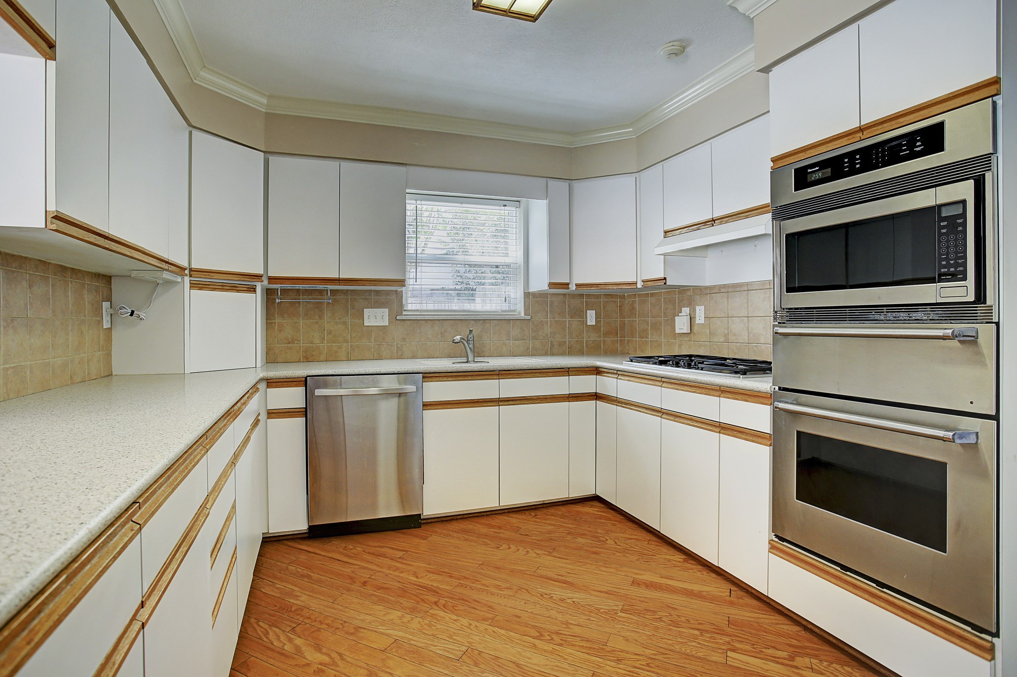 Cabinets and drawers wrap around the kitchen, keeping cookware close and counters ready for whatevers on the menu.