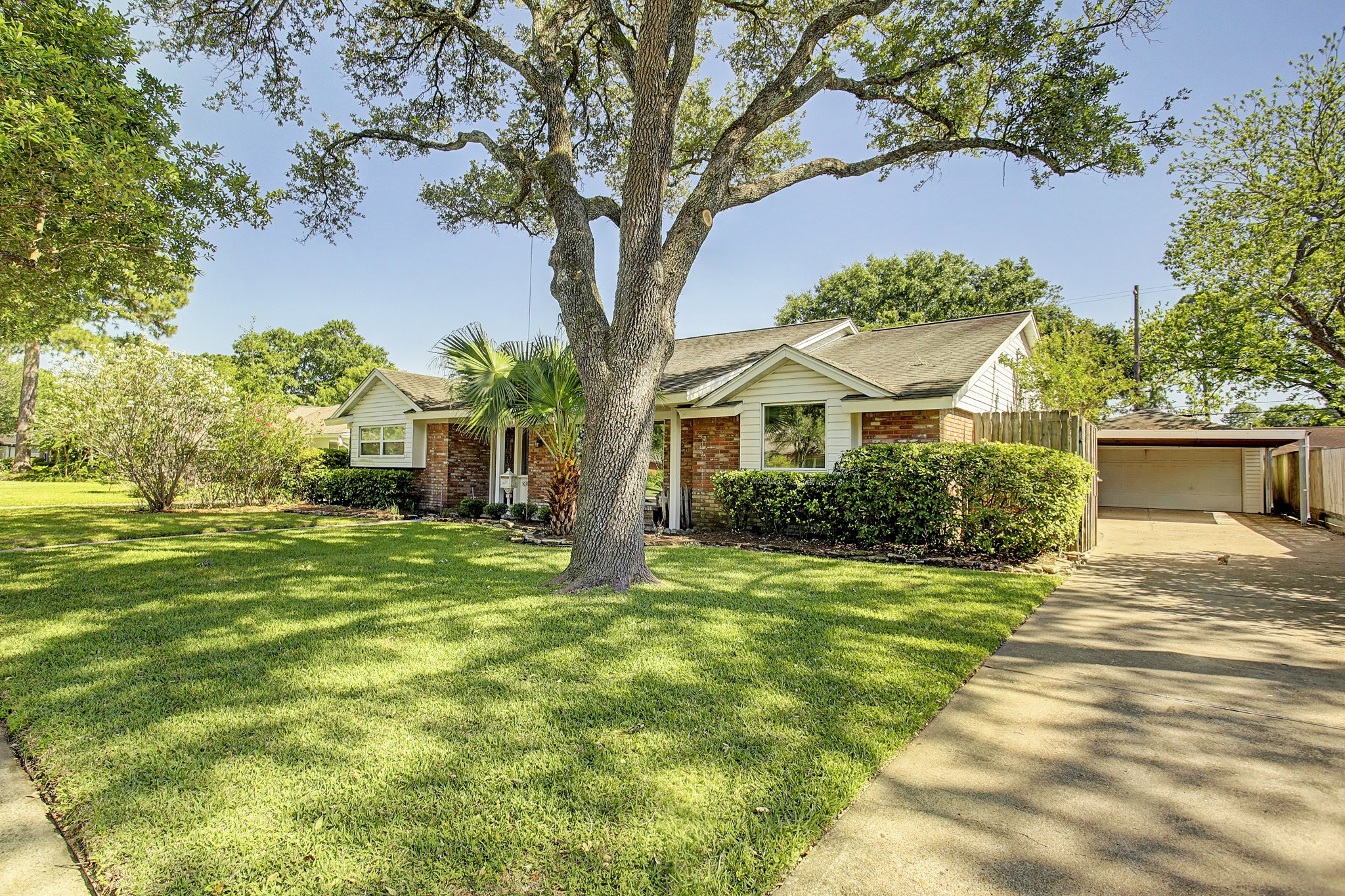 A long driveway, covered carport, and two-car garage give you parking options without sacrificing curb appeal. A long driveway, covered carport, and two-car garage give you parking options without sacrificing curb appeal.