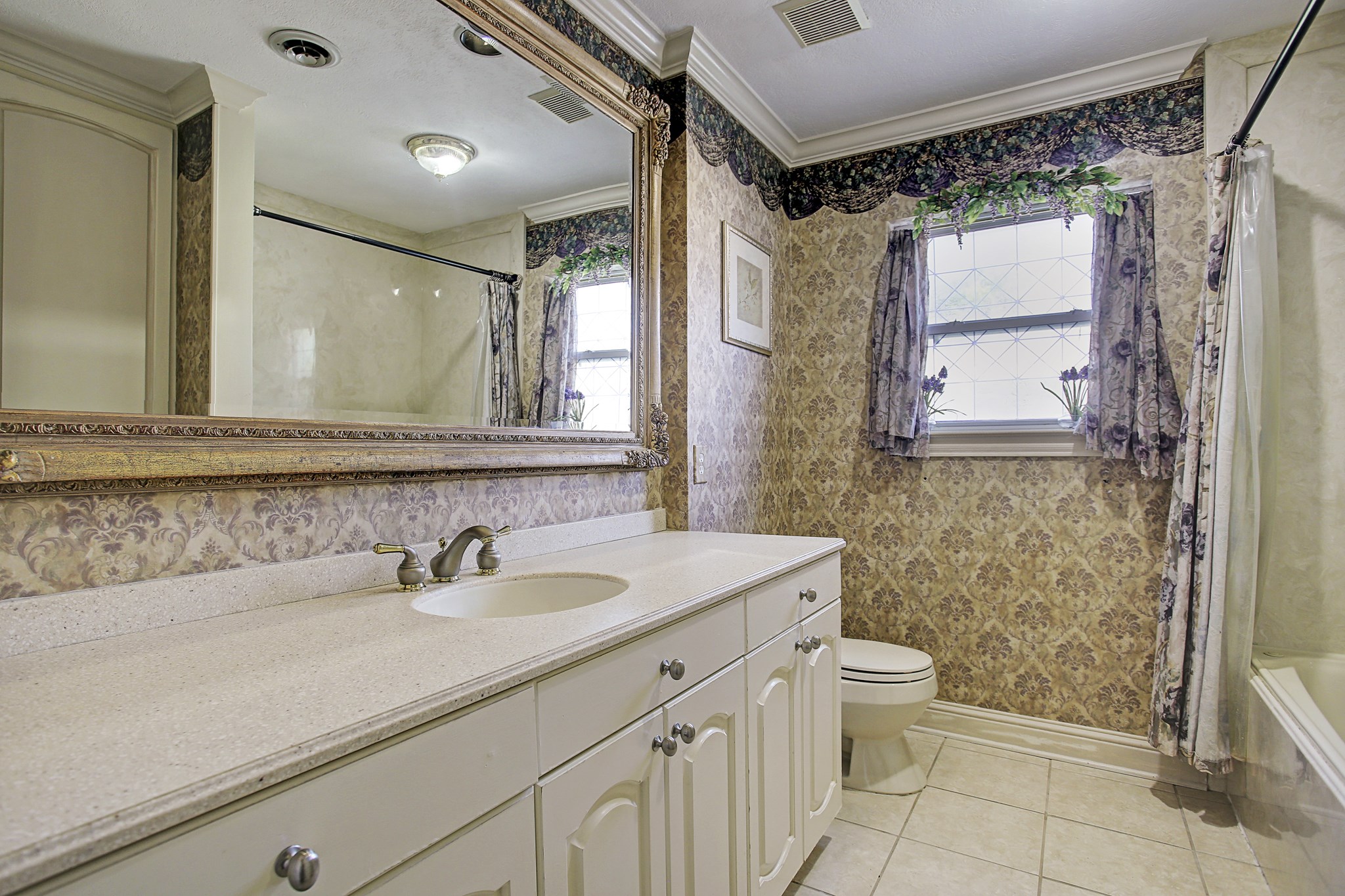 A generous bathroom counter means your skincare routine doesnt have to negotiate for space, with storage below for the extras.
