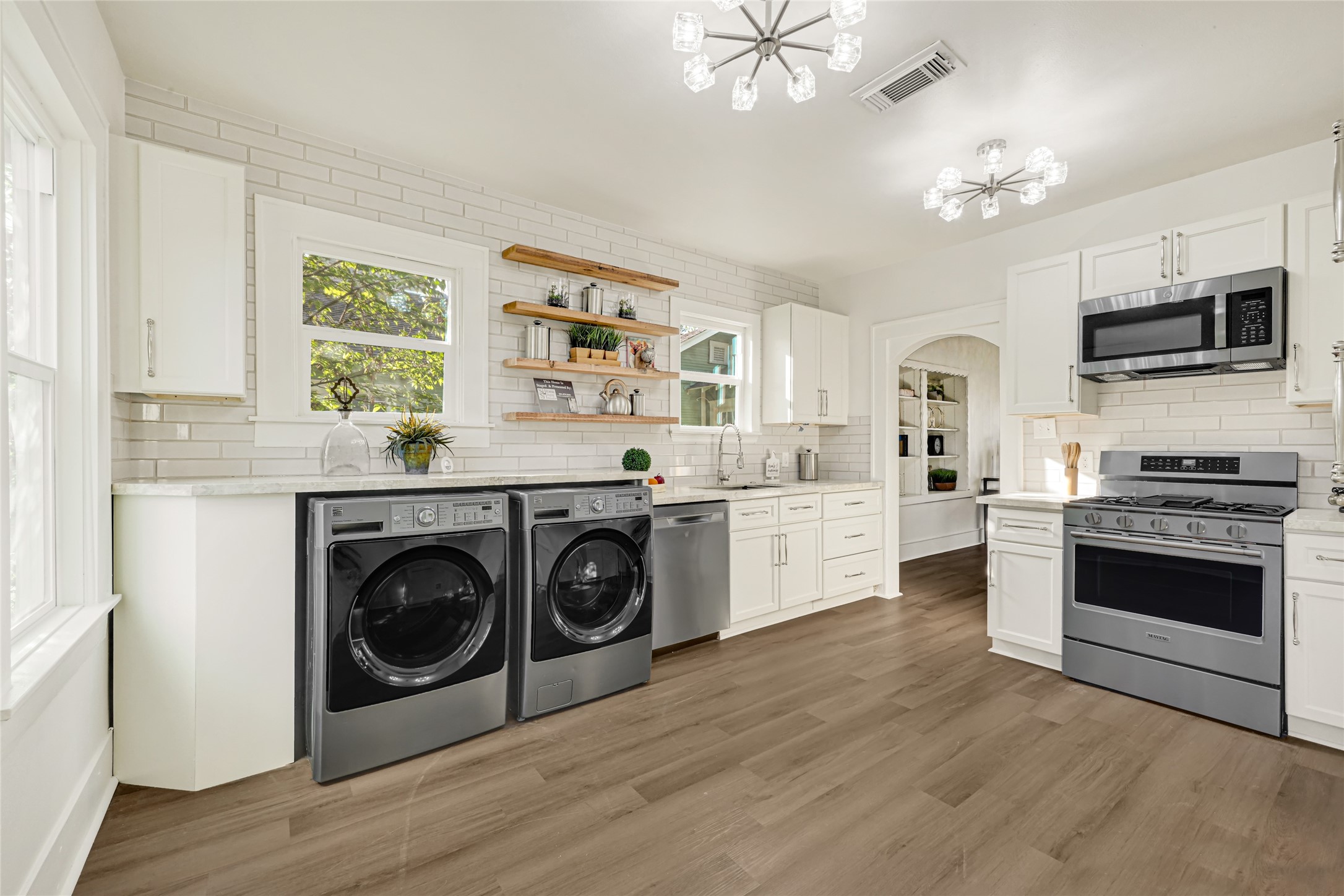 Functional, updated kitchen with marble countertops & SS appliances.  Gas Oven & Stove