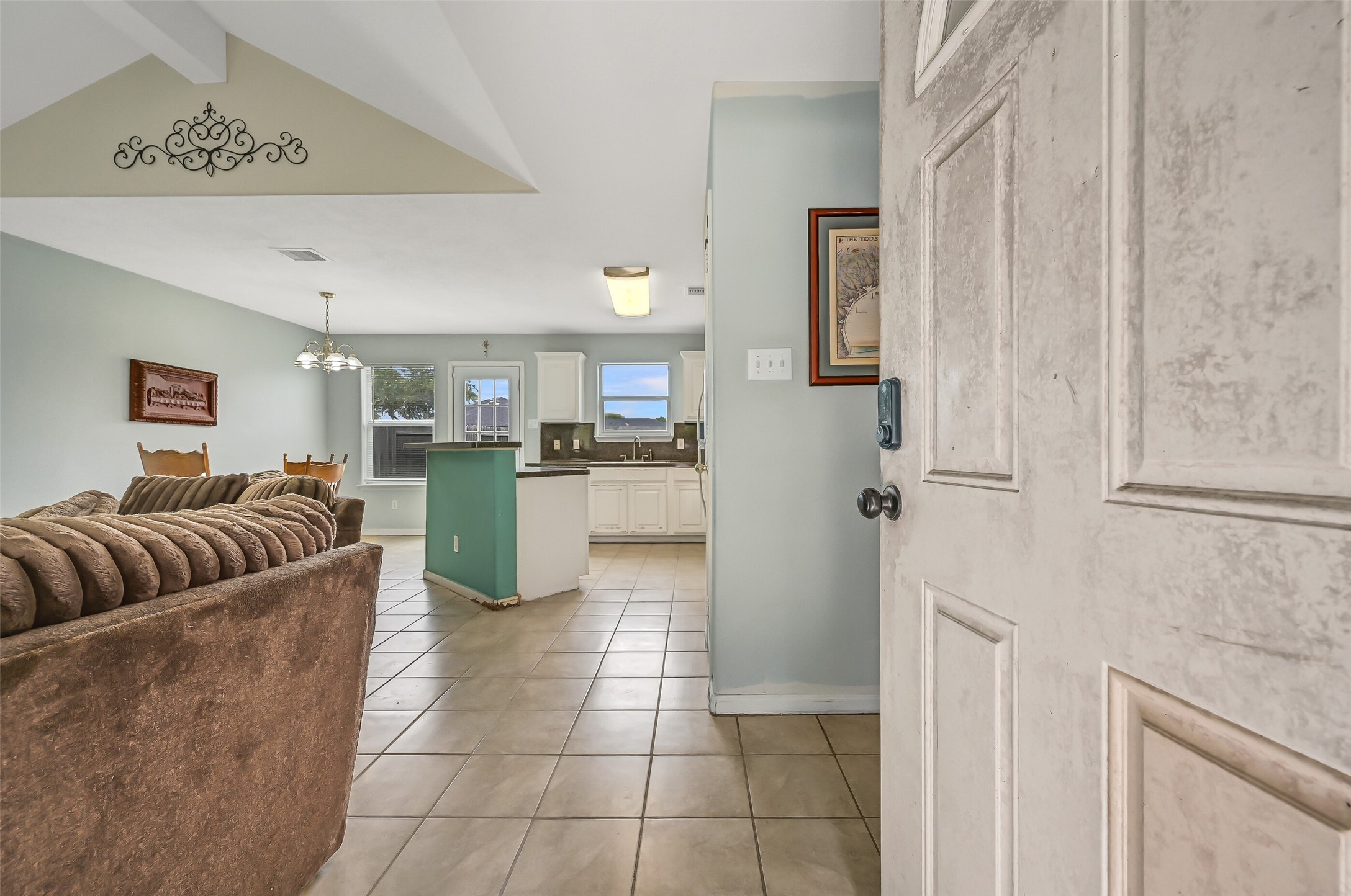 Step inside to an open layout where the family room, dining area, and kitchen flow easily together. Tile flooring extends throughout the main living spaces for easy everyday upkeep.