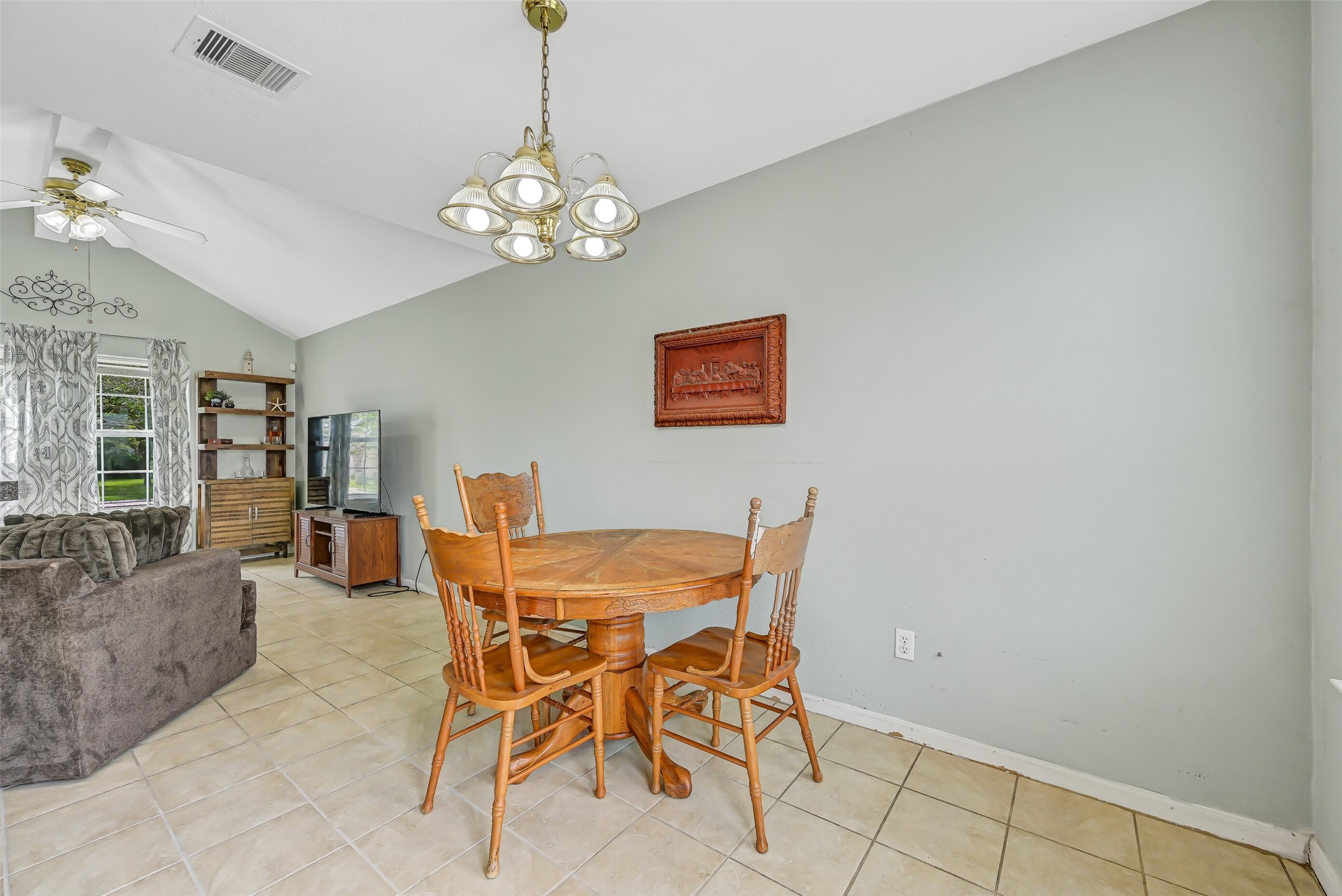 The dining area sits between the family room and kitchen, creating an easy, open flow for meals and gatherings while maintaining plenty of room for a full-size dining table.