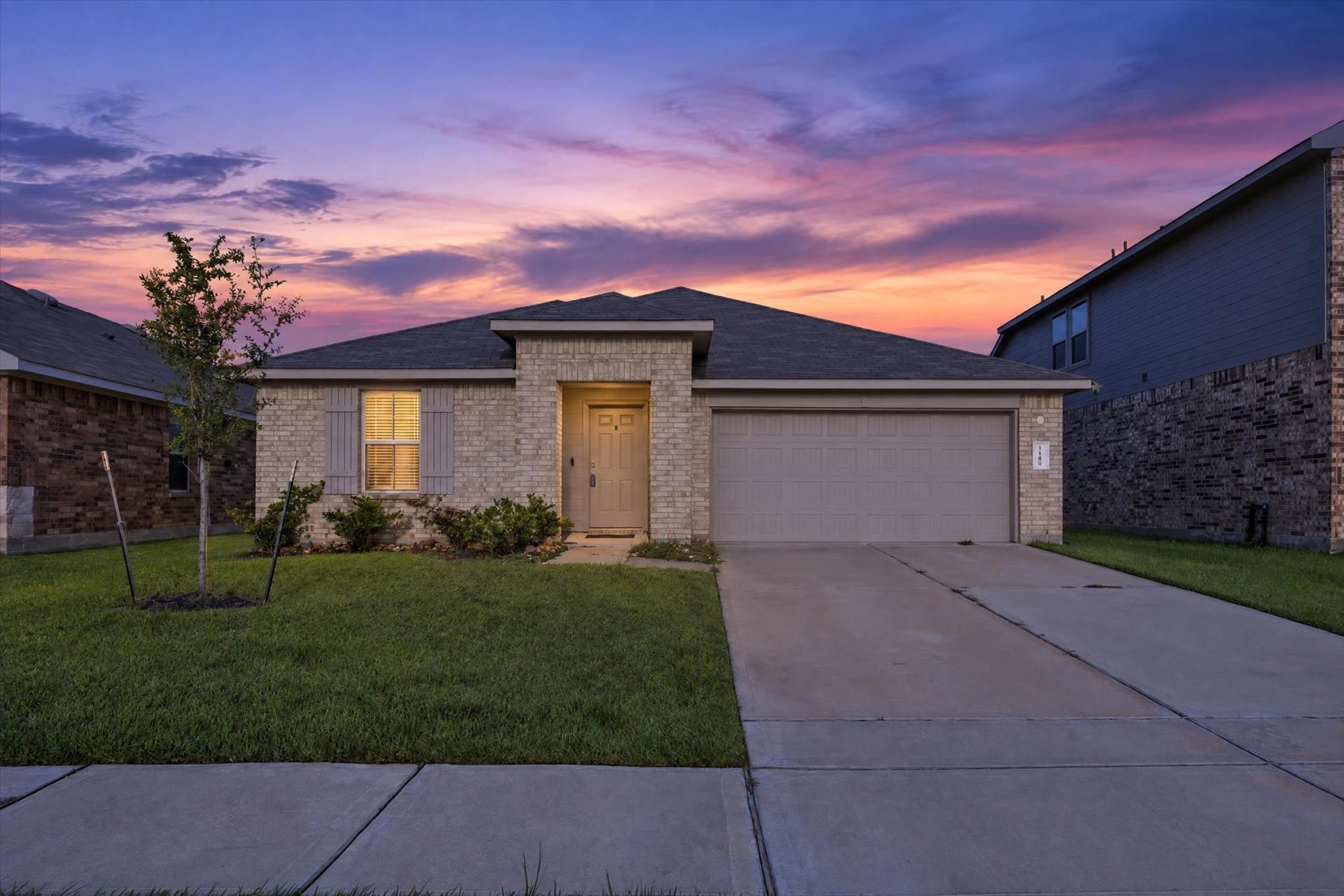 Stunning twilight view of the front elevation.
