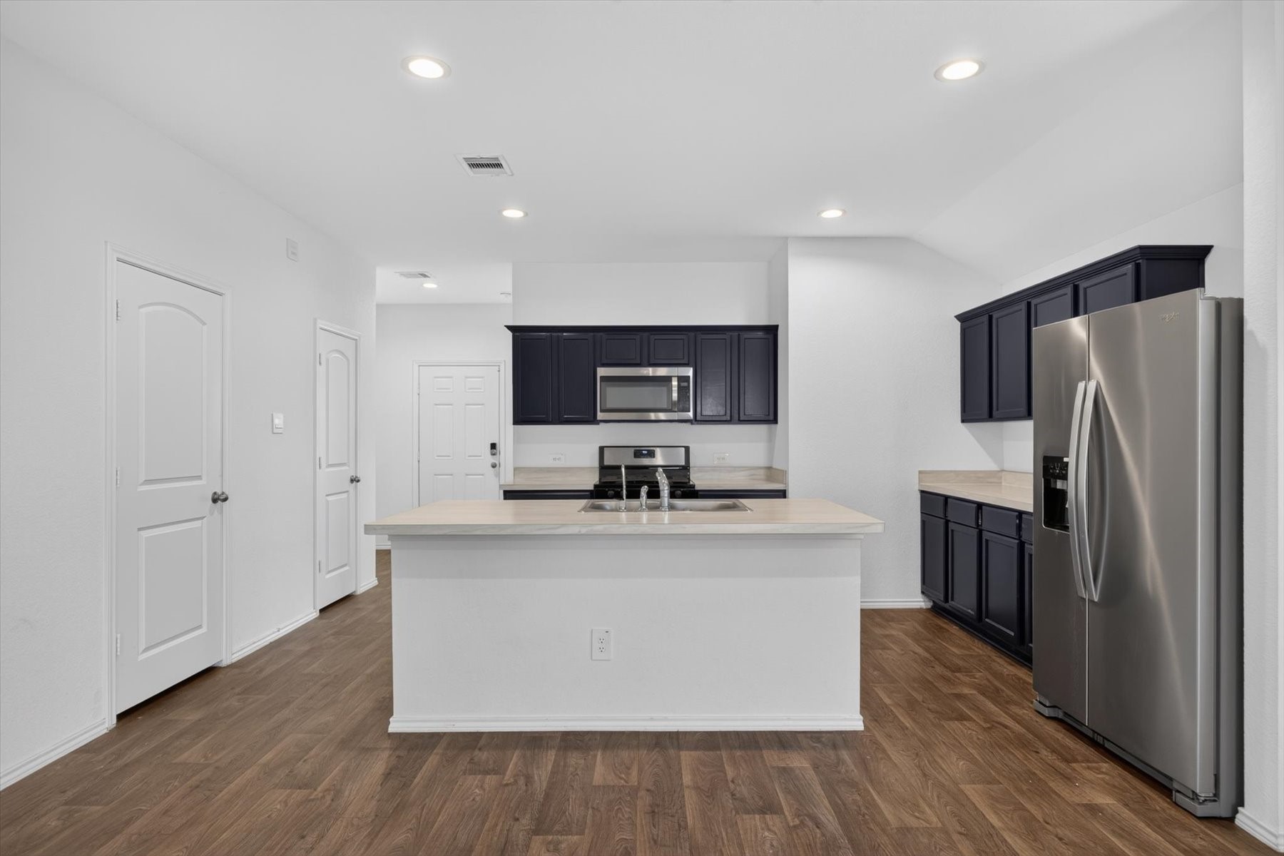 Spacious island kitchen with abundant cabinetry. Spacious island kitchen with abundant cabinetry.