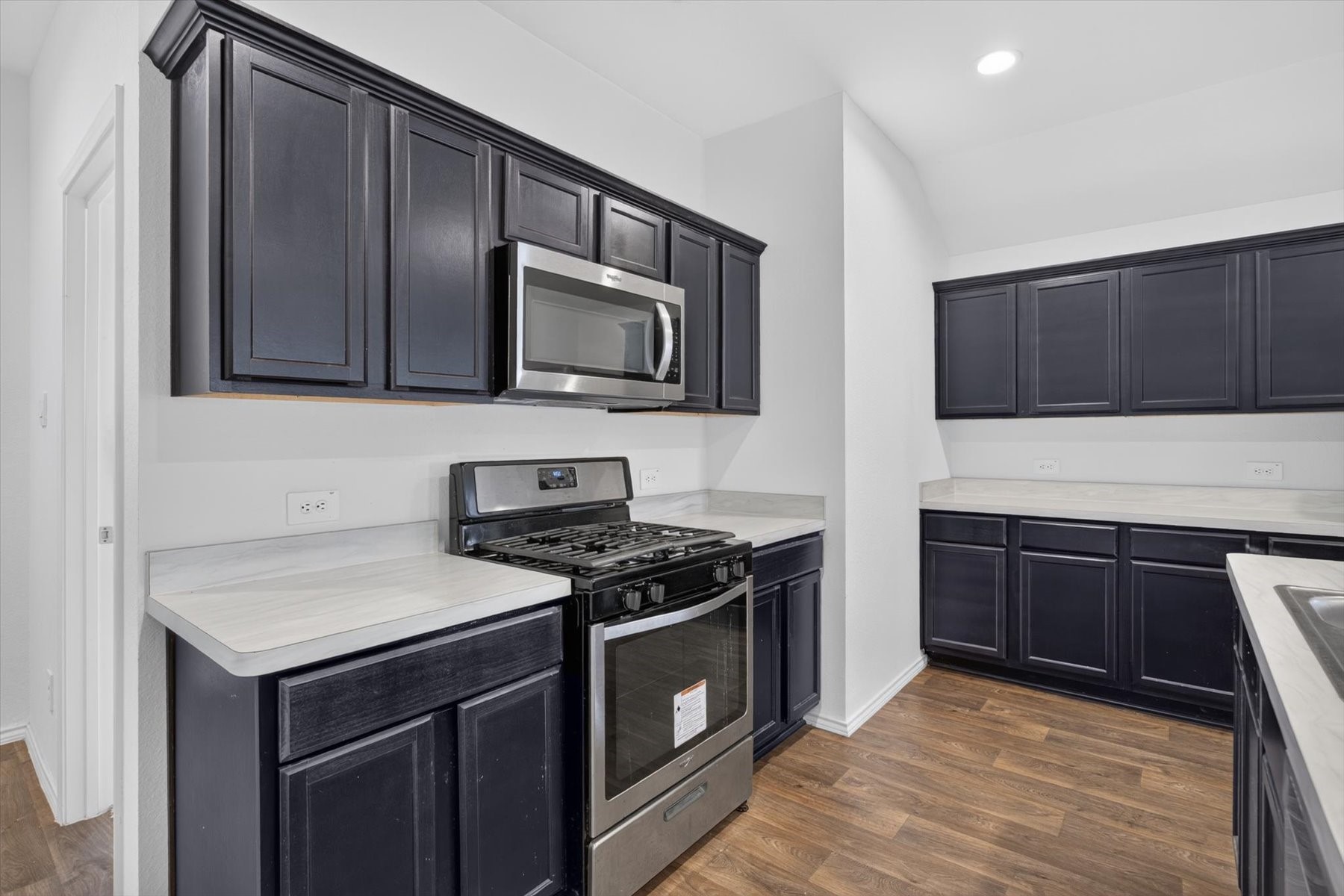 Kitchen featuring stainless steel appliances and generous counter space.
