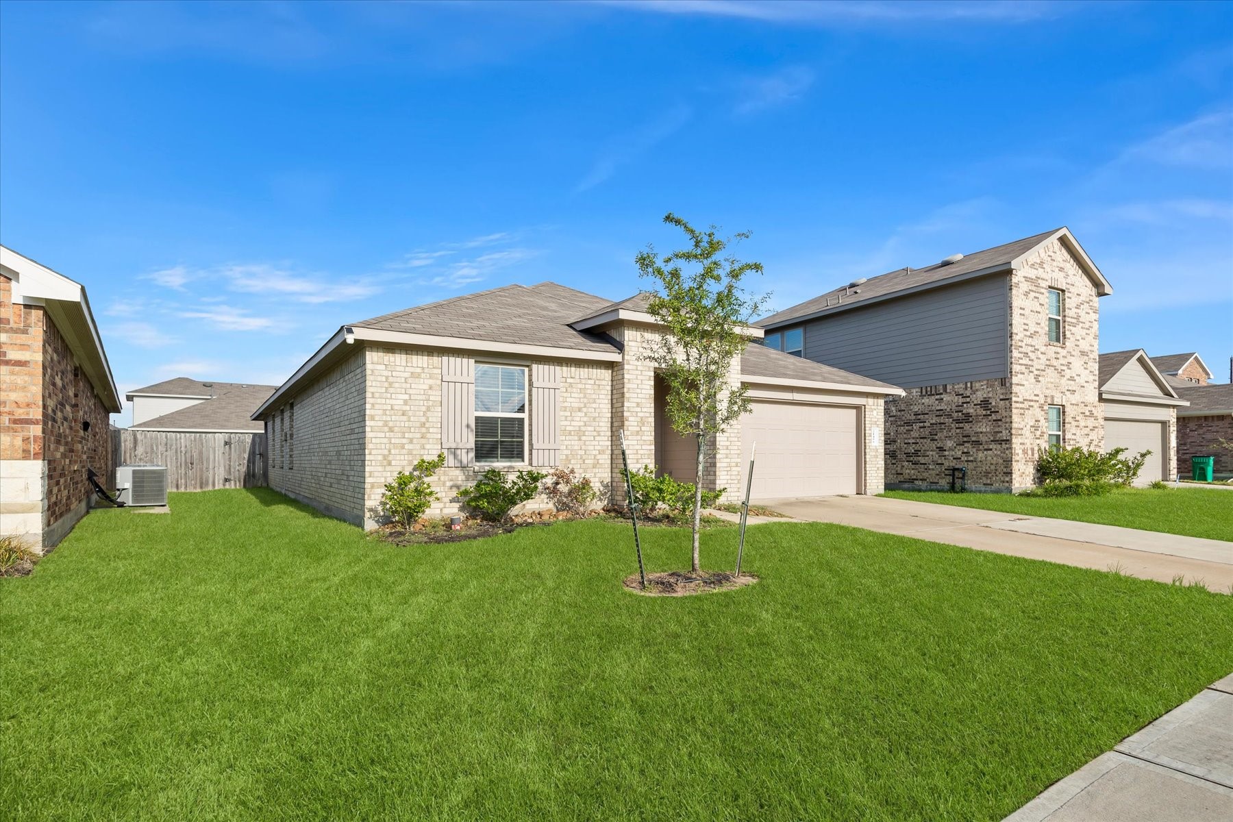 Charming front elevation with manicured lawn.